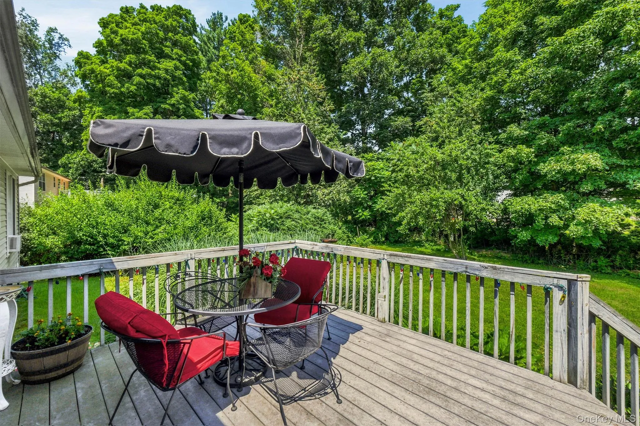 Wood-finish deck with a perimeter railing Wood-finish deck with a perimeter railing