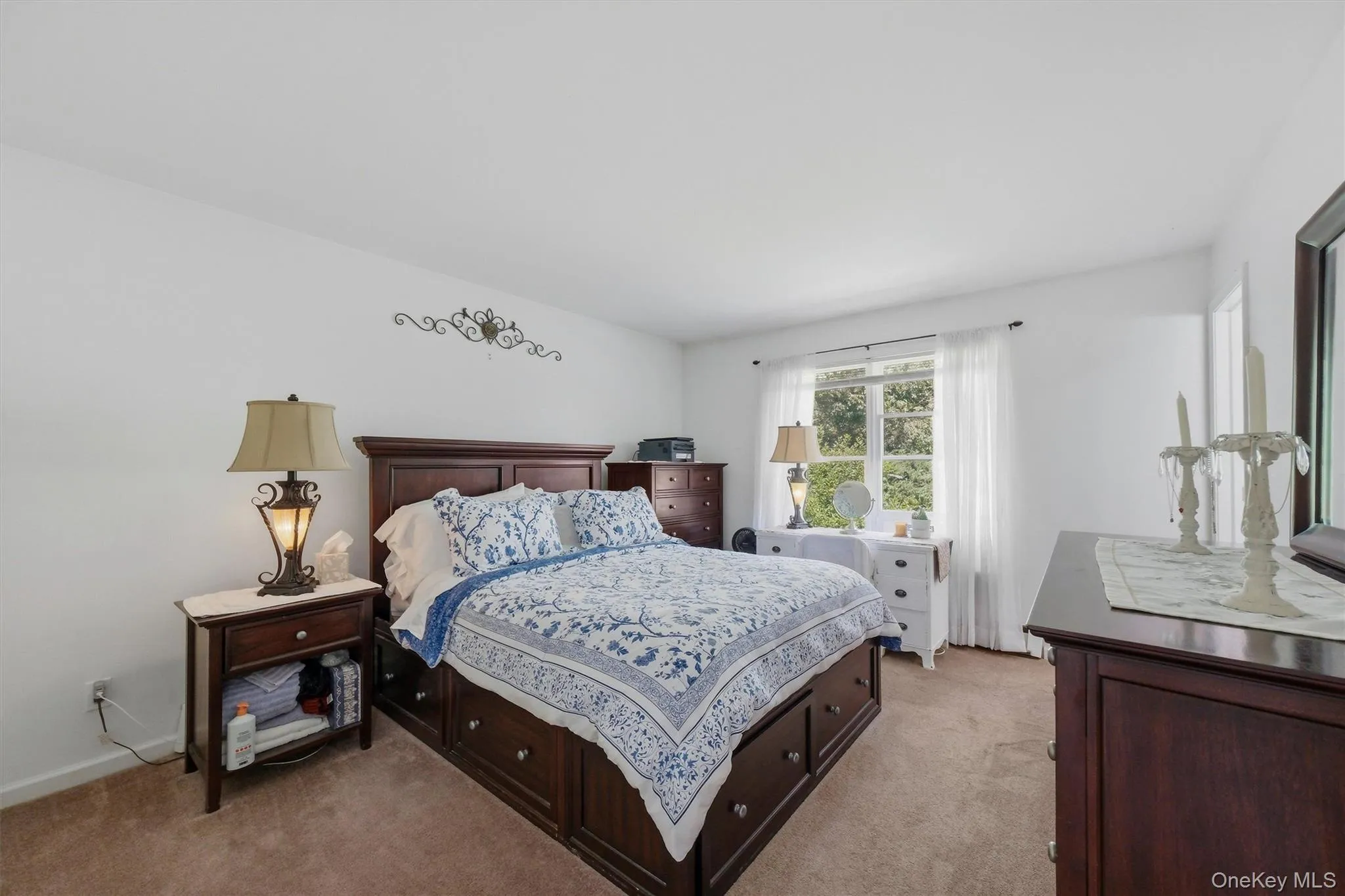 White painted walls with a window featuring white sheers White painted walls with a window featuring white sheers