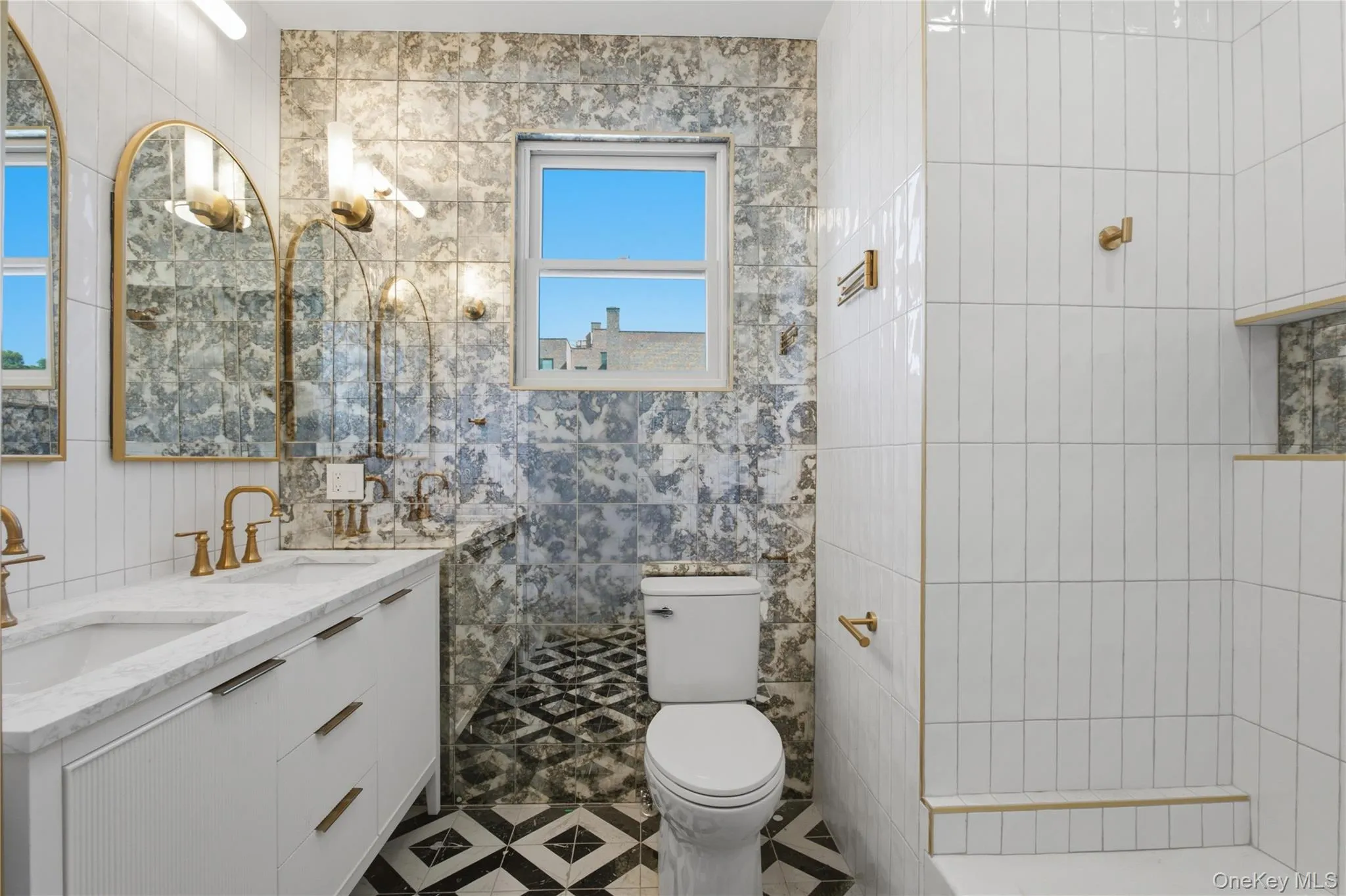 Beautifully Renovated Bathroom — Bright and stylish with elegant tilework, a modern vanity, walk-in shower, and natural light, combining modern luxury with timeless character. Beautifully Renovated Bathroom — Bright and stylish with elegant tilework, a modern vanity, walk-in shower, and natural light, combining modern luxury with timeless character.