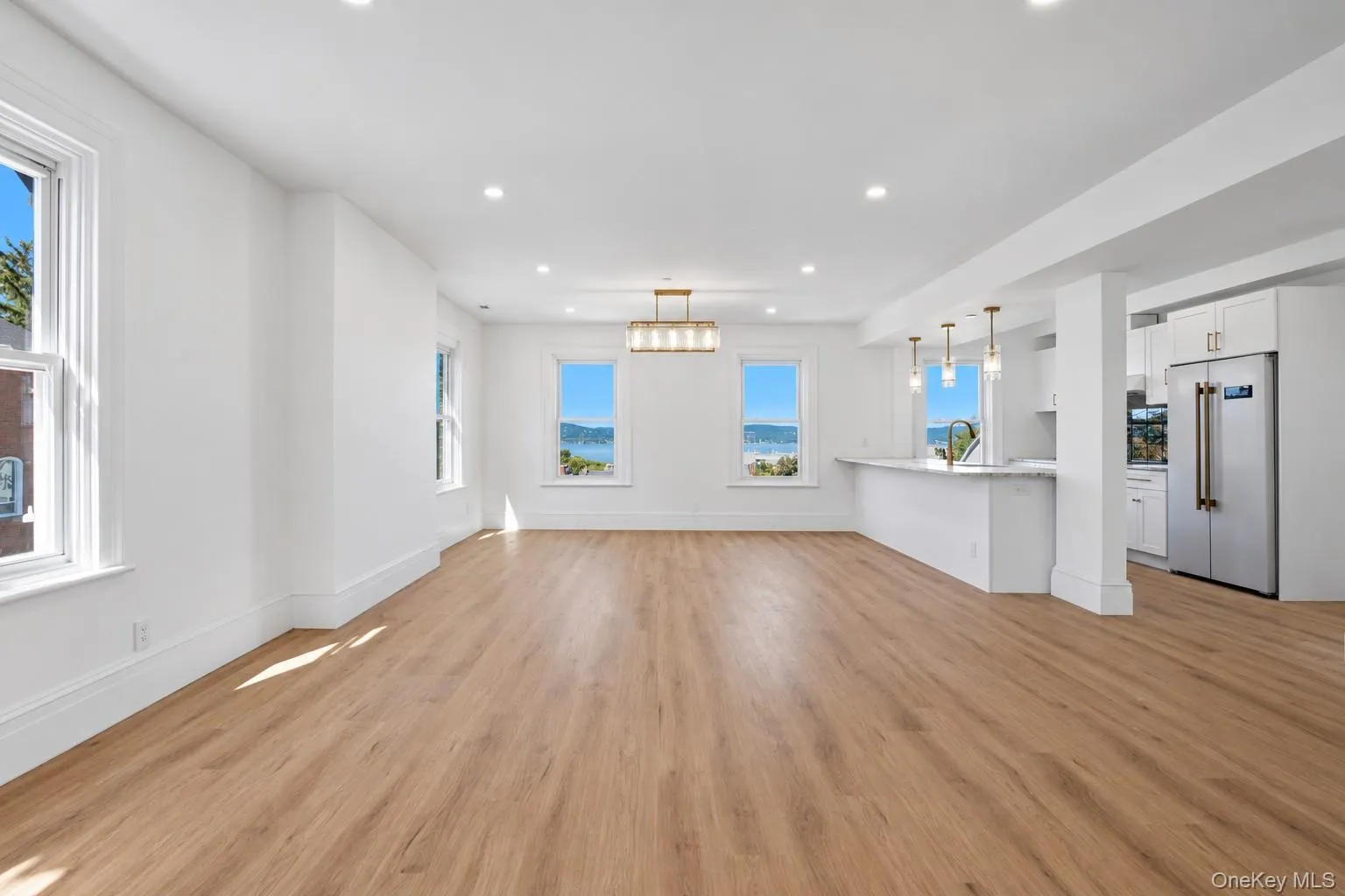 Unit1: Open-Concept Living & Kitchen Area with Spectacular Hudson River and Mario Cuomo Bridge Views Unit1: Open-Concept Living & Kitchen Area with Spectacular Hudson River and Mario Cuomo Bridge Views
