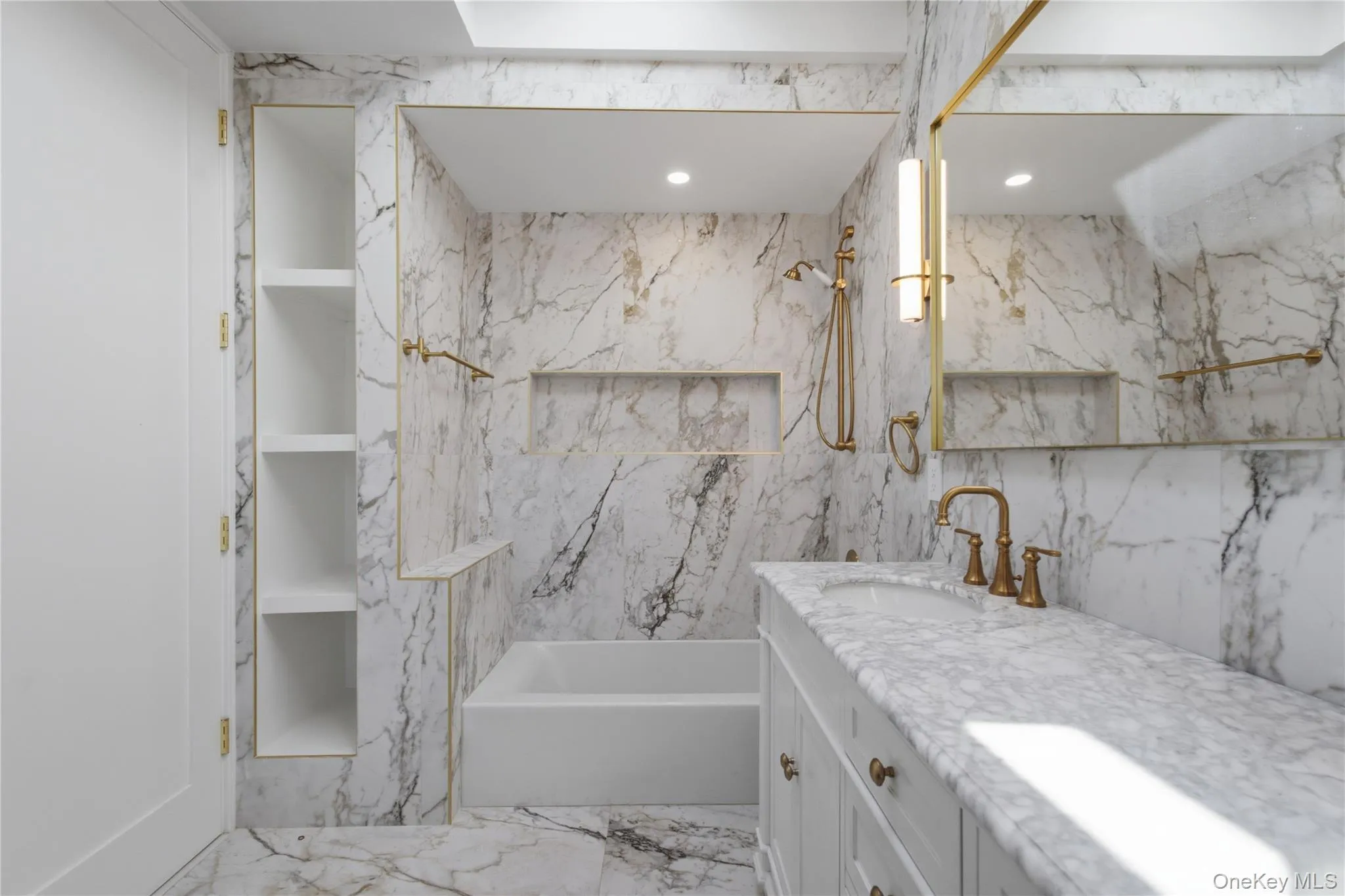 Luxurious Spa-Inspired Bathroom — Beautifully renovated with elegant marble finishes, a spacious vanity, modern fixtures, and a relaxing soaking tub, creating a bright and sophisticated retreat. Luxurious Spa-Inspired Bathroom — Beautifully renovated with elegant marble finishes, a spacious vanity, modern fixtures, and a relaxing soaking tub, creating a bright and sophisticated retreat.