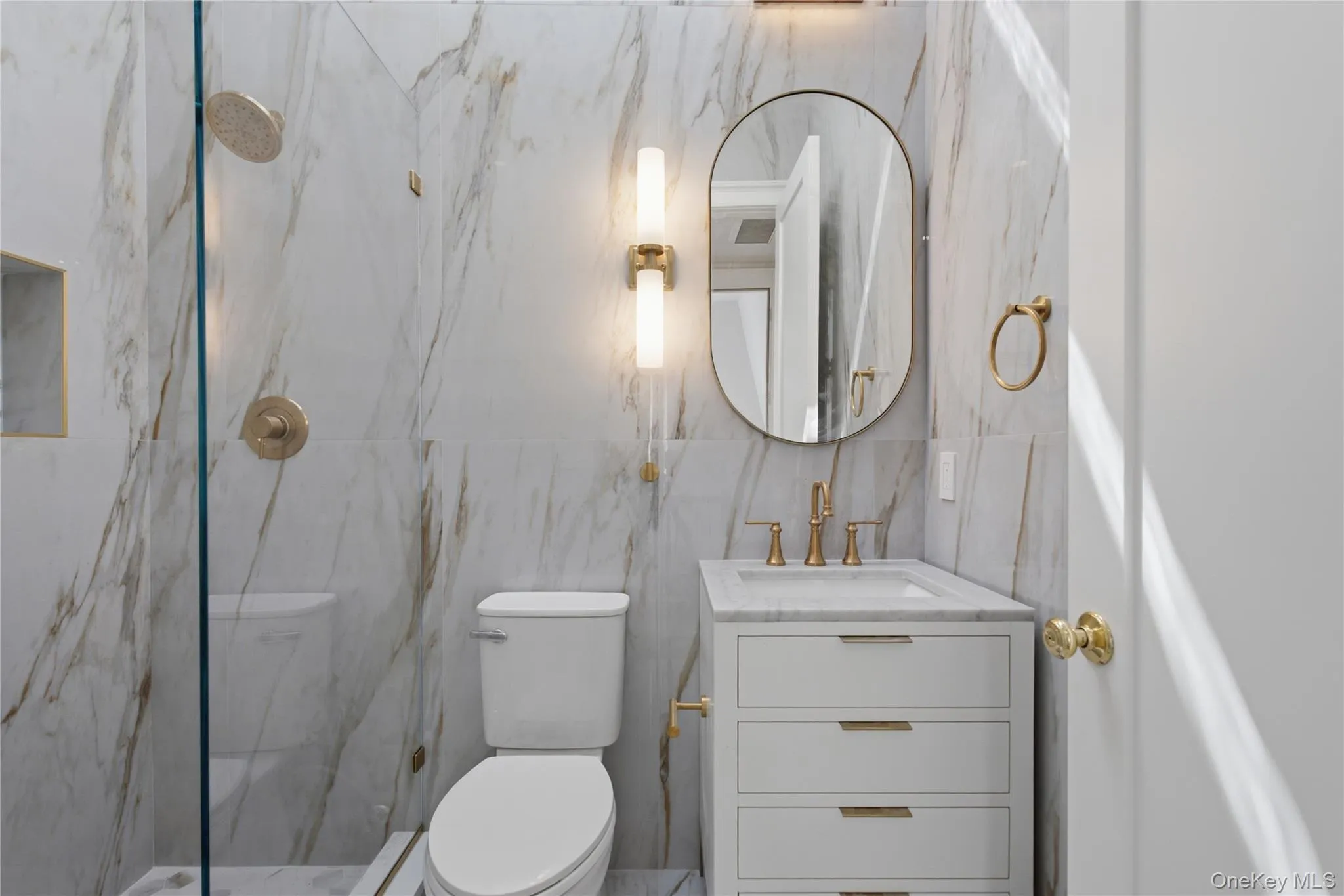Beautifully Renovated Bathroom with a View — Elegant tilework, a modern vanity, and walk-in shower are complemented by natural light and scenic views, creating a bright and luxurious retreat. Beautifully Renovated Bathroom with a View — Elegant tilework, a modern vanity, and walk-in shower are complemented by natural light and scenic views, creating a bright and luxurious retreat.