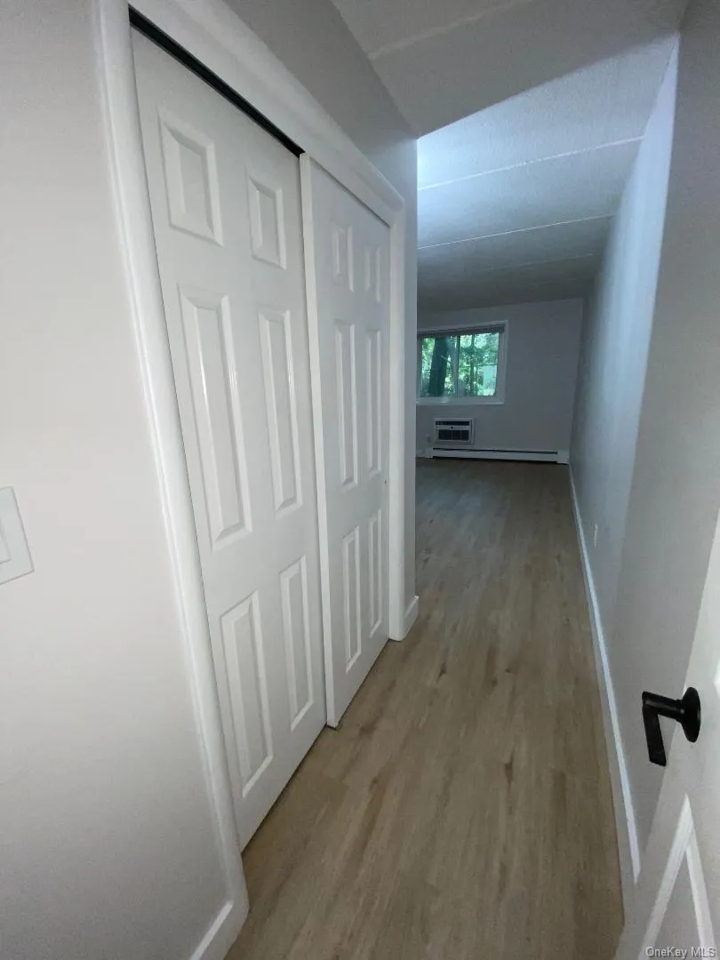Entry to the spacious primary bedroom which has 2 double closet and wood like flooring Entry to the spacious primary bedroom which has 2 double closet and wood like flooring