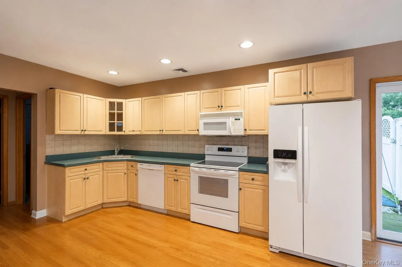 Second kitchen, providing flexibility, photo was virtually decluttered Second kitchen, providing flexibility, photo was virtually decluttered