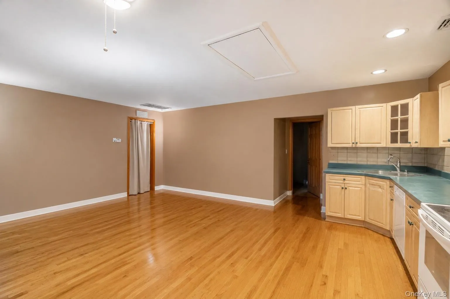 living space next to second kitchen, providing flexibility, photo was virtually decluttered living space next to second kitchen, providing flexibility, photo was virtually decluttered