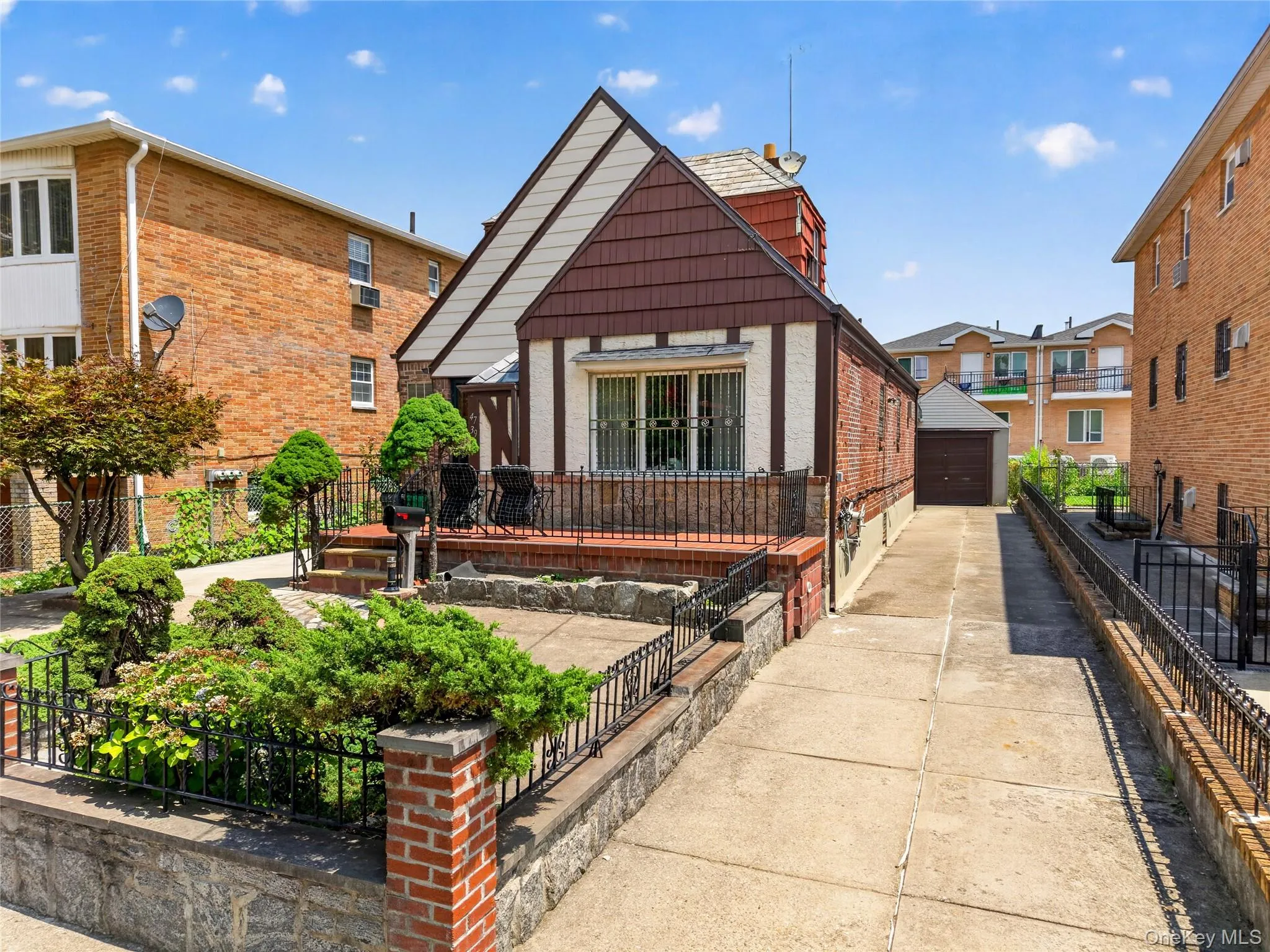 Tudor-style home with brick and stucco siding Tudor-style home with brick and stucco siding