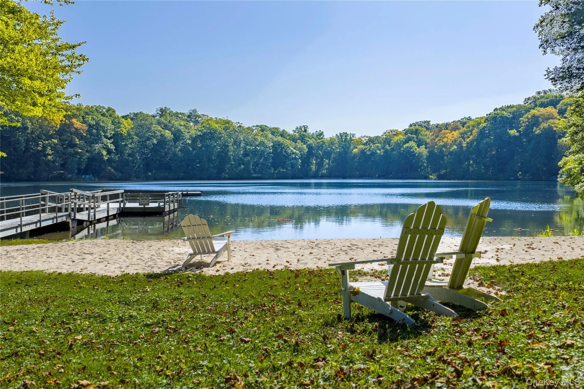 Residents enjoy exclusive access to a sandy beach and docks. Residents enjoy exclusive access to a sandy beach and docks.