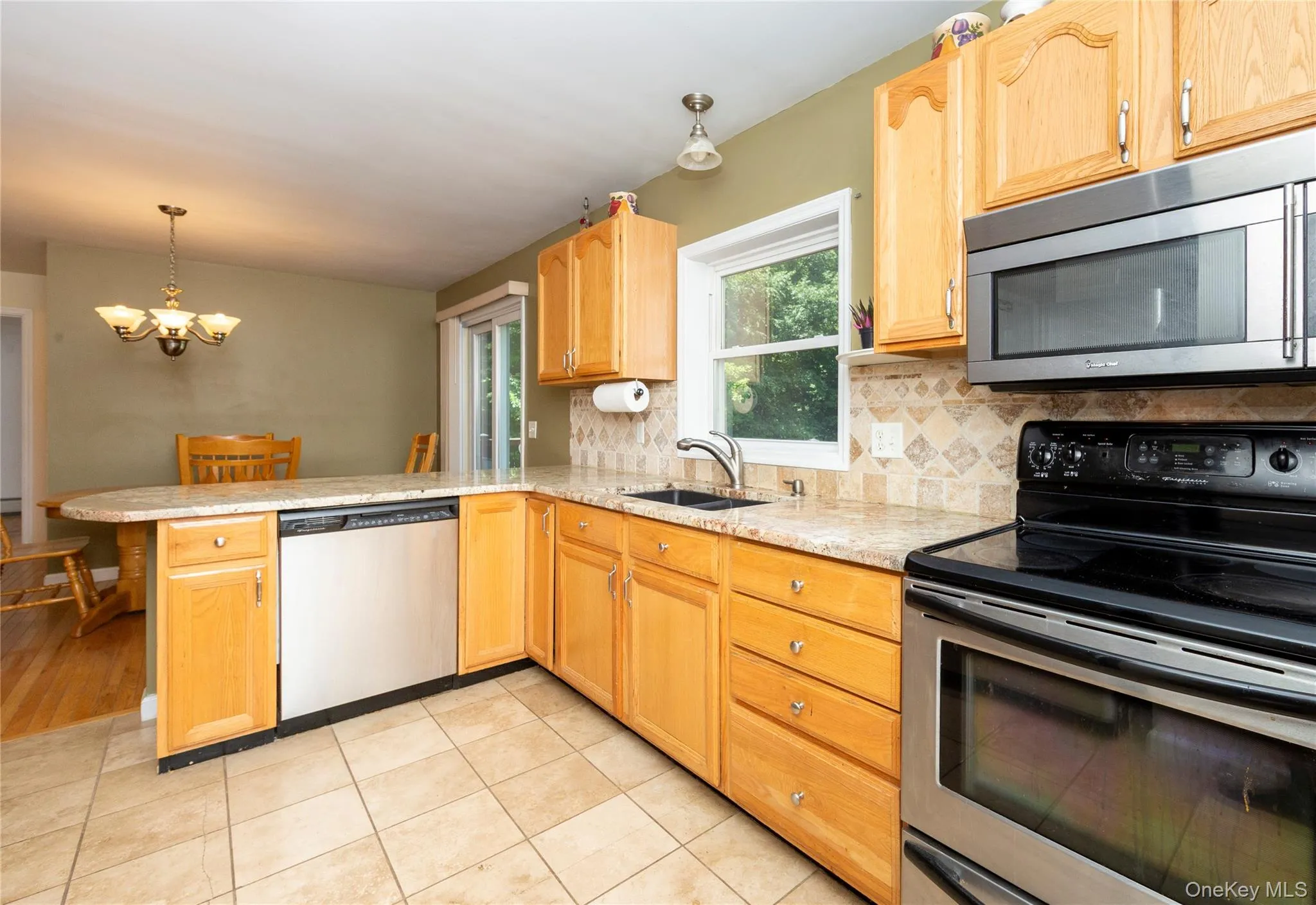 Granite counters and tiled backsplash. Granite counters and tiled backsplash.