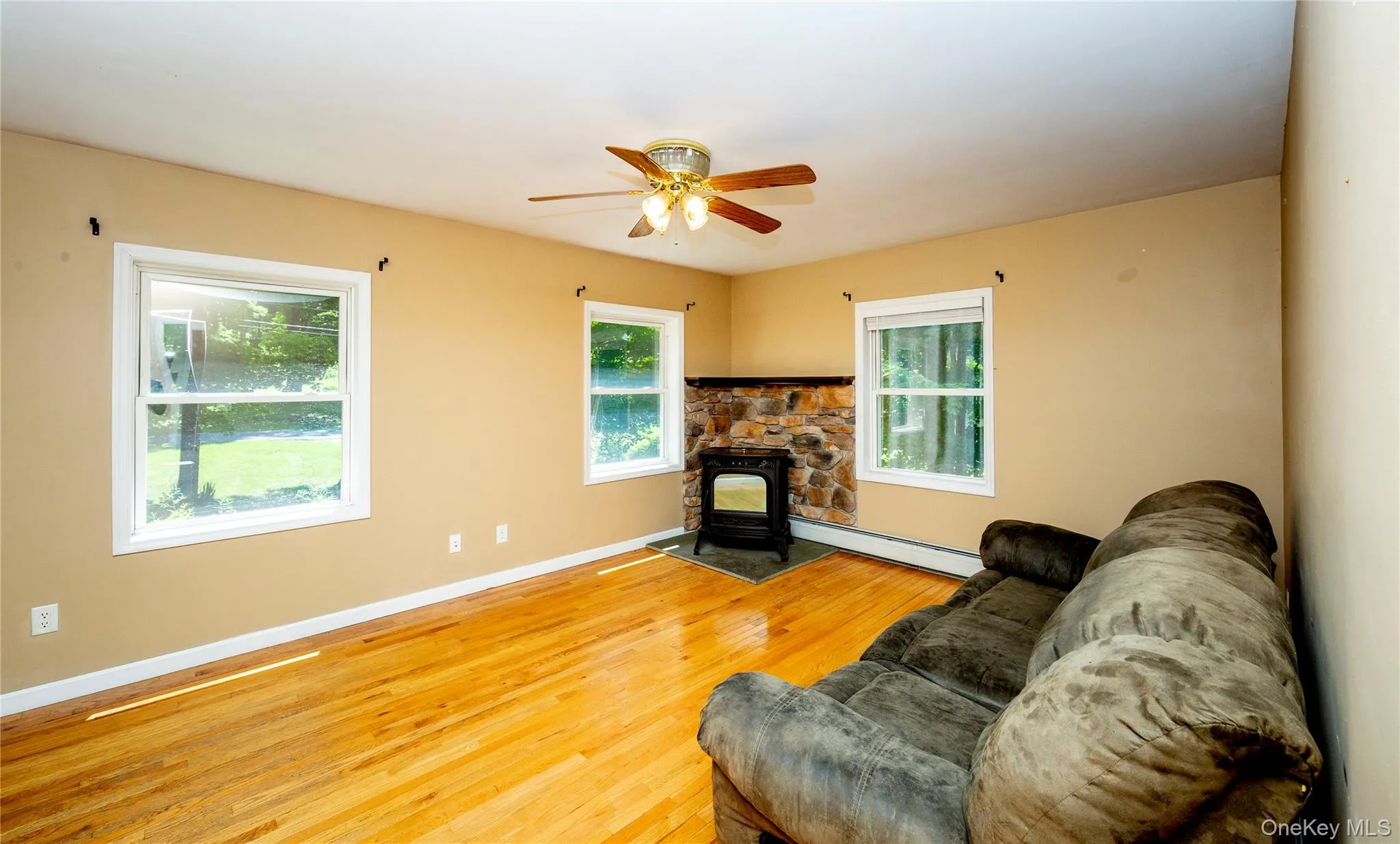 The main level offers a living room warmed by a pellet stove. The main level offers a living room warmed by a pellet stove.