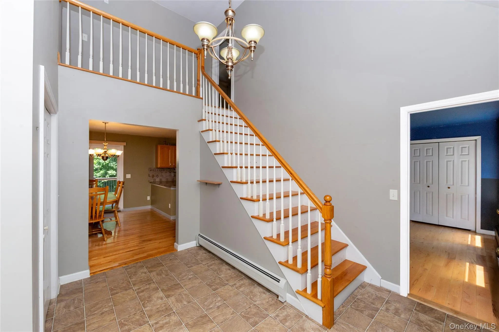 Stairs lead to open balcony overlooking the entry and the second floor. Stairs lead to open balcony overlooking the entry and the second floor.