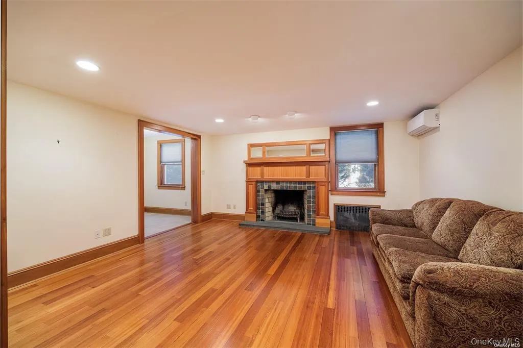 Gorgeous Living Area with Wood Burning Fireplace and Incredible Hardwood Floors Gorgeous Living Area with Wood Burning Fireplace and Incredible Hardwood Floors