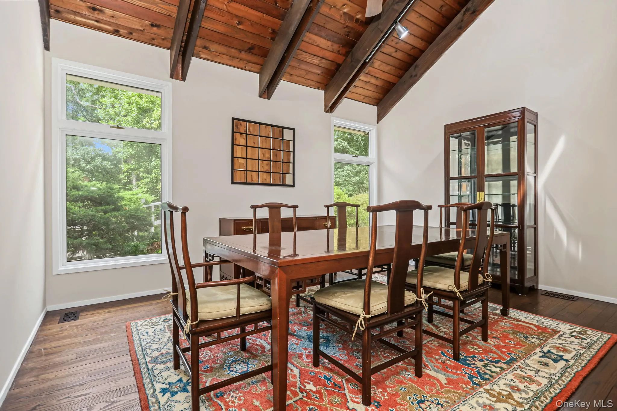 With large qindows and high beamed ceilings, With large qindows and high beamed ceilings,