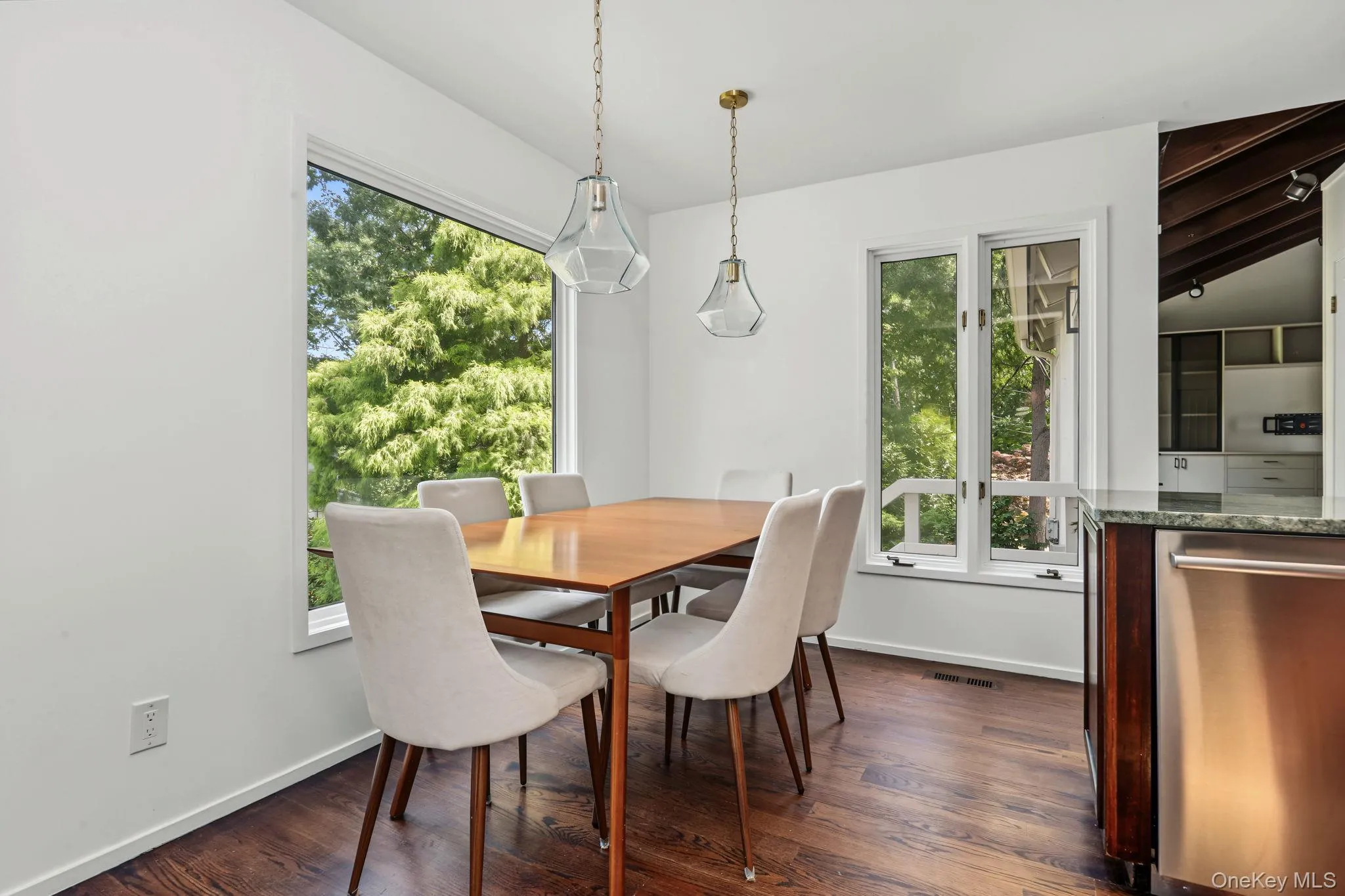 Eat-in kitchen with floor to ceiling windows. Eat-in kitchen with floor to ceiling windows.