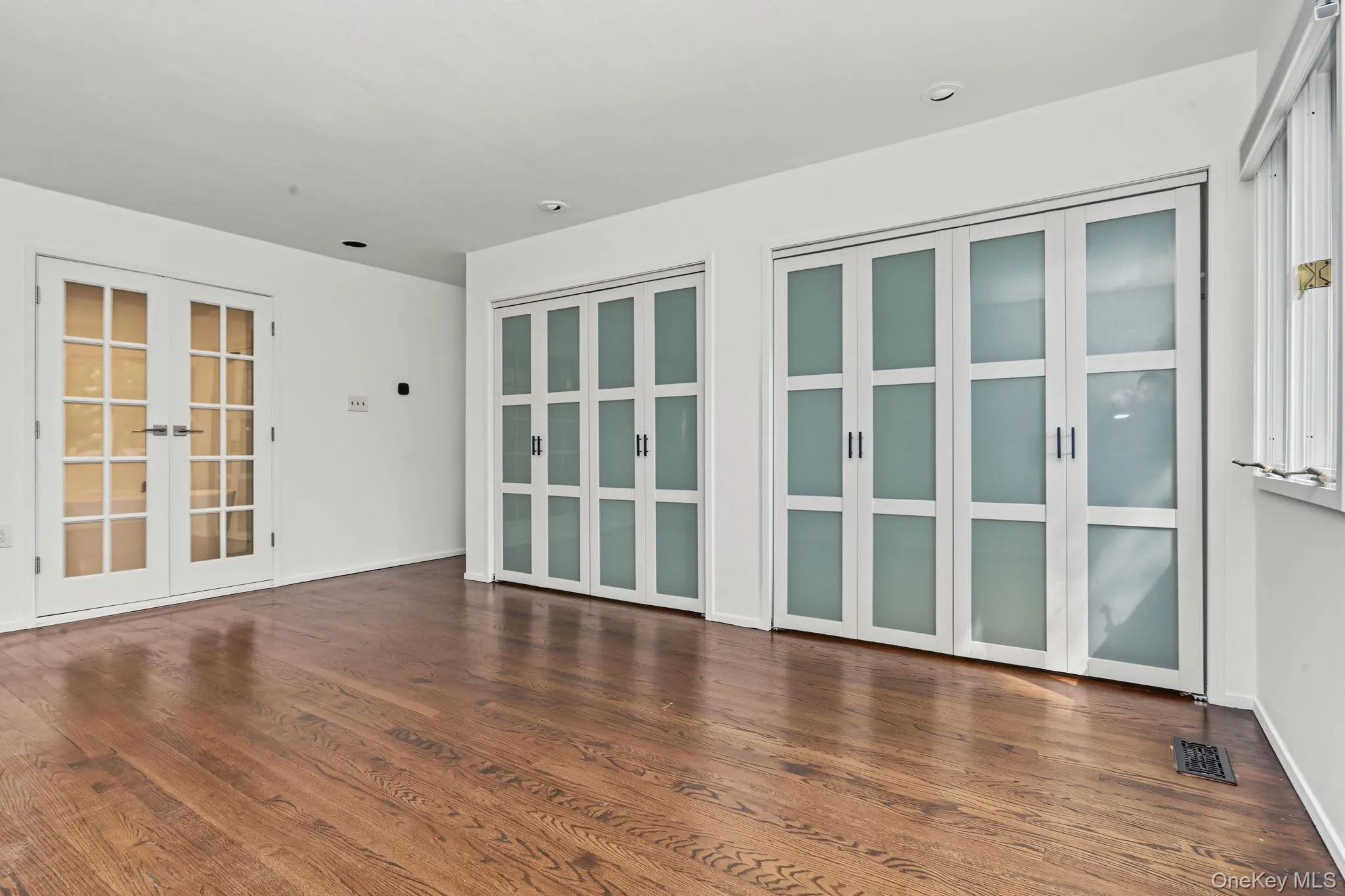 Priamry bedroom suitw with glass doors to primary bath. Priamry bedroom suitw with glass doors to primary bath.