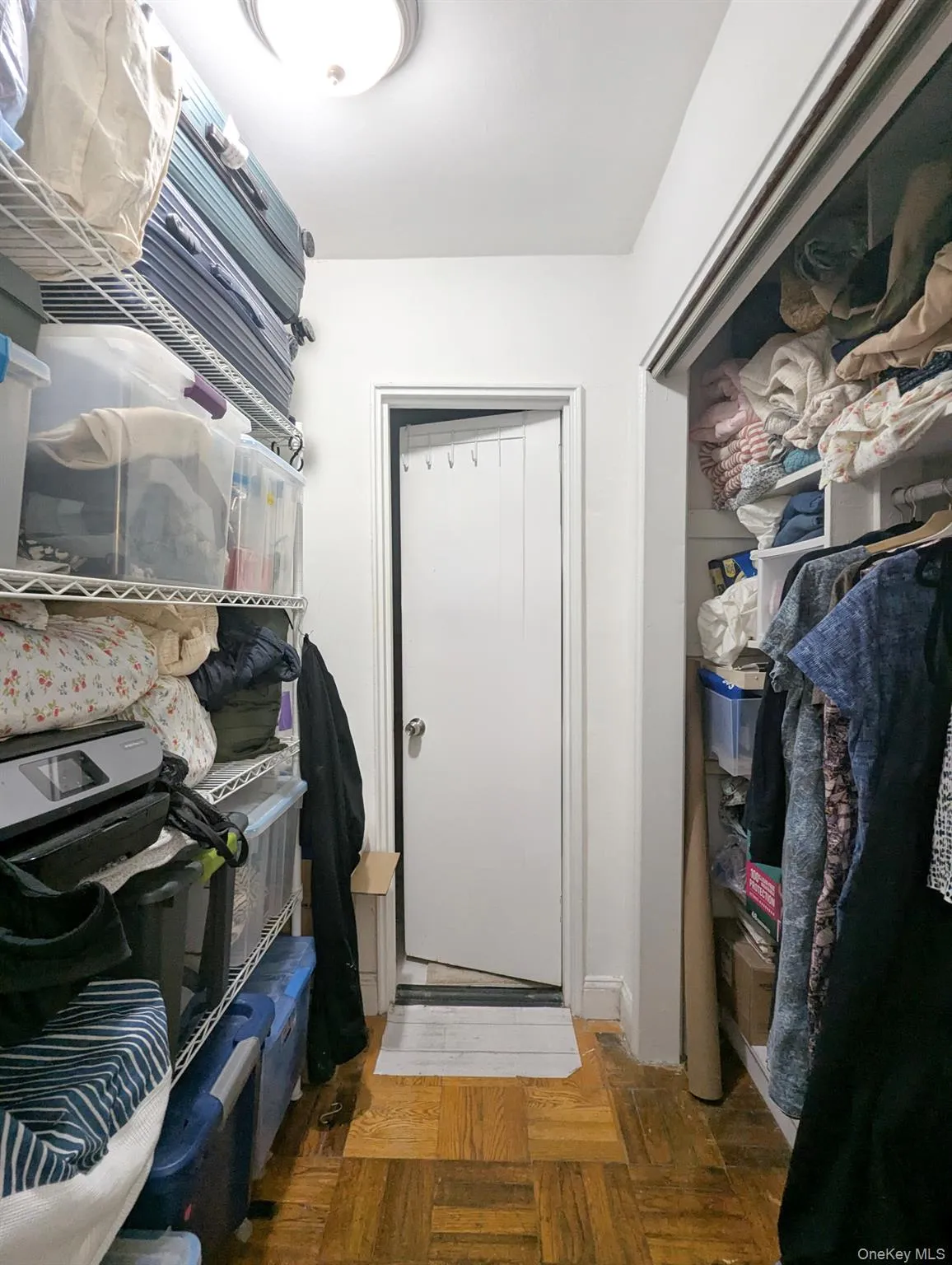 Spacious walk-in closet features additional storage space leading into the bathroom. Spacious walk-in closet features additional storage space leading into the bathroom.