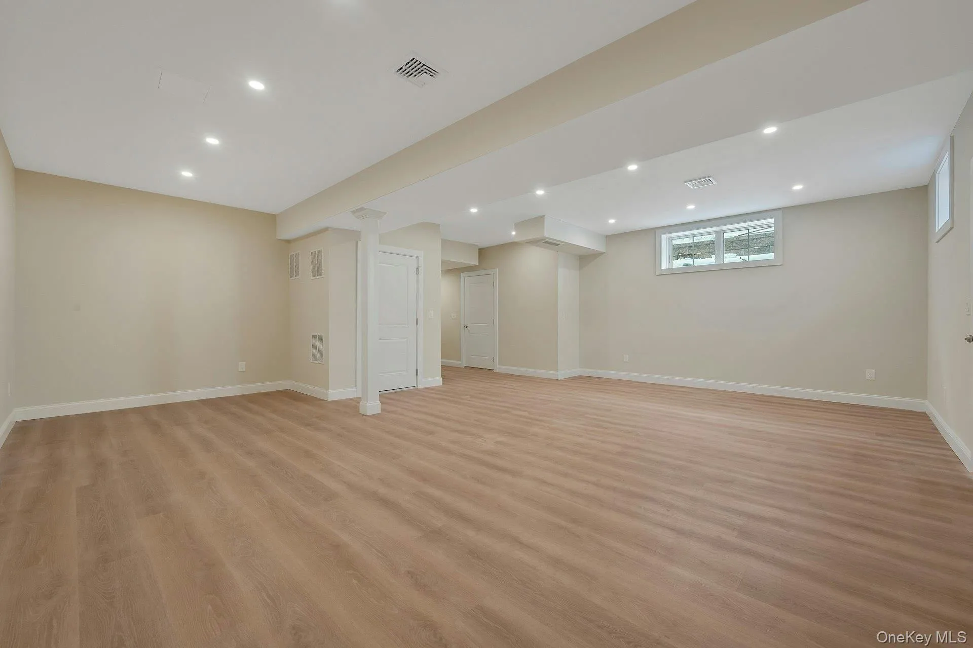 View of recreation room looking at its beautiful flooring and recessed lighting View of recreation room looking at its beautiful flooring and recessed lighting