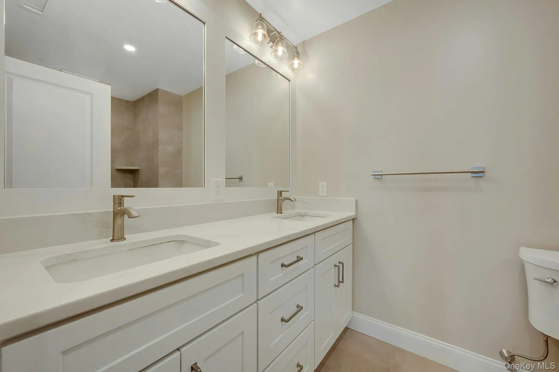 Primary bathroom offering double vanities Primary bathroom offering double vanities