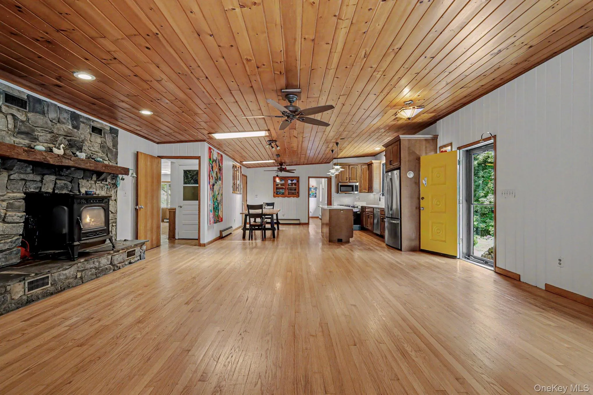 Open floor plan with stone fireplace Open floor plan with stone fireplace