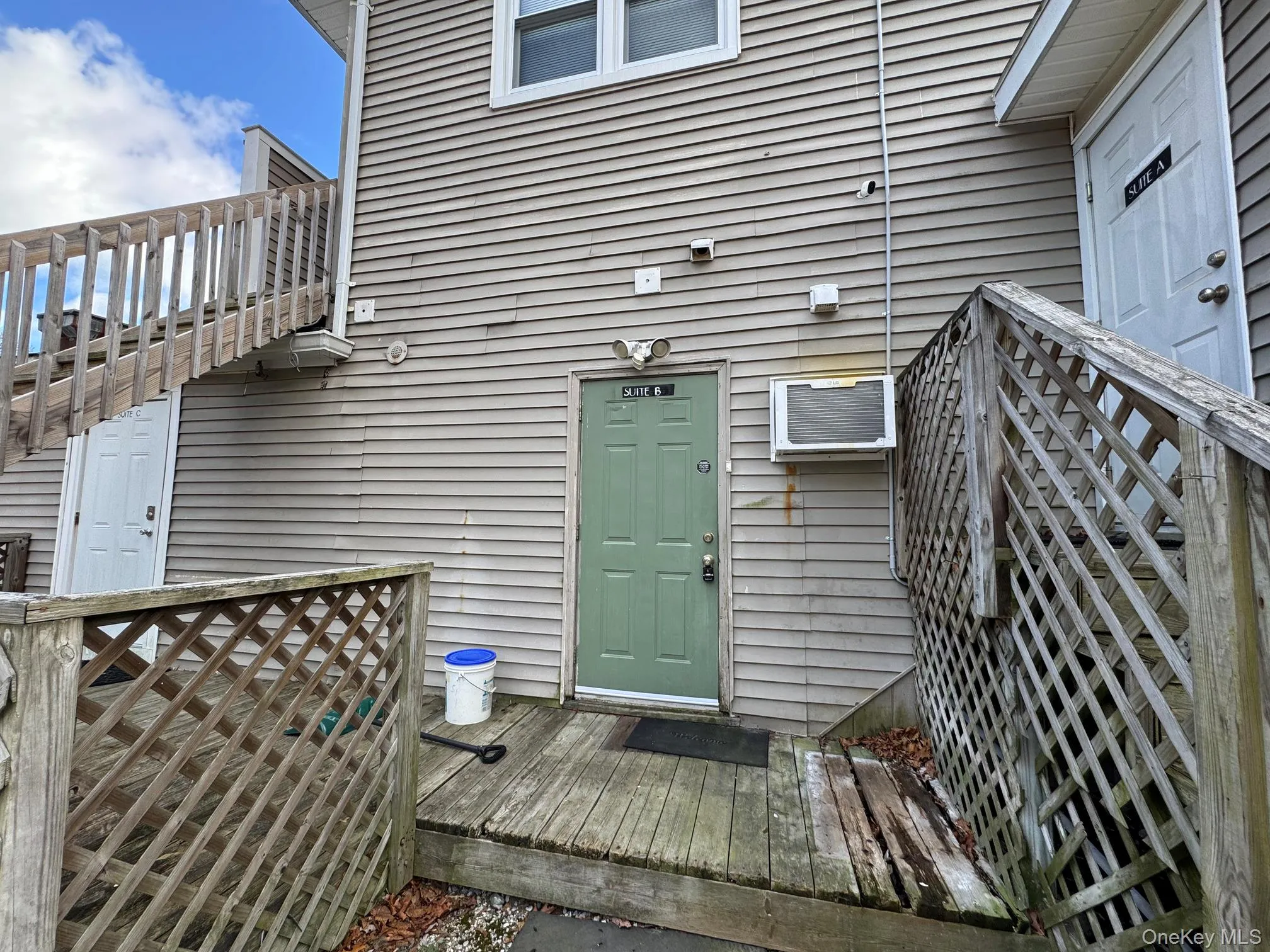 Property entrance featuring a wall unit AC Property entrance featuring a wall unit AC