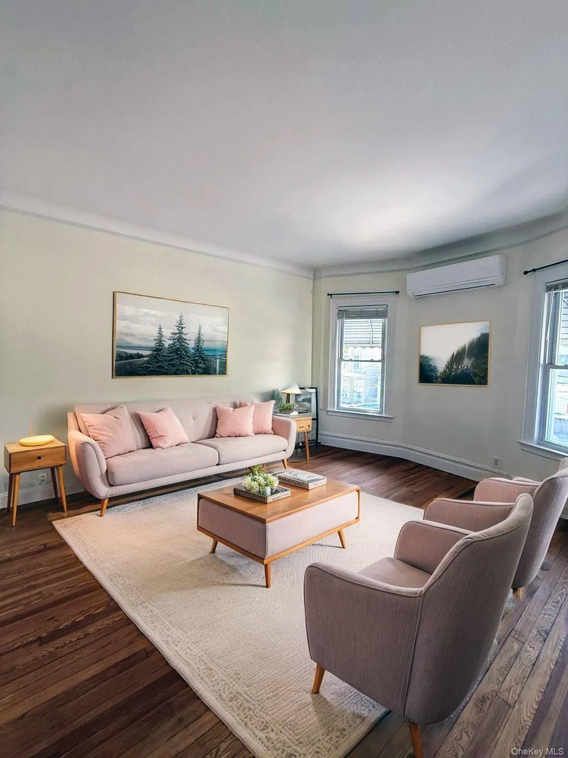 Rich wood-finish flooring complements the room's light-toned walls Rich wood-finish flooring complements the room's light-toned walls