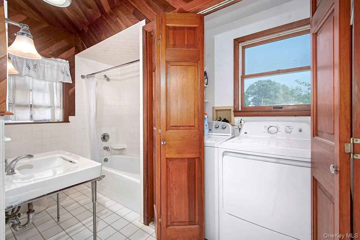 Full Bathroom with Laundry area Full Bathroom with Laundry area