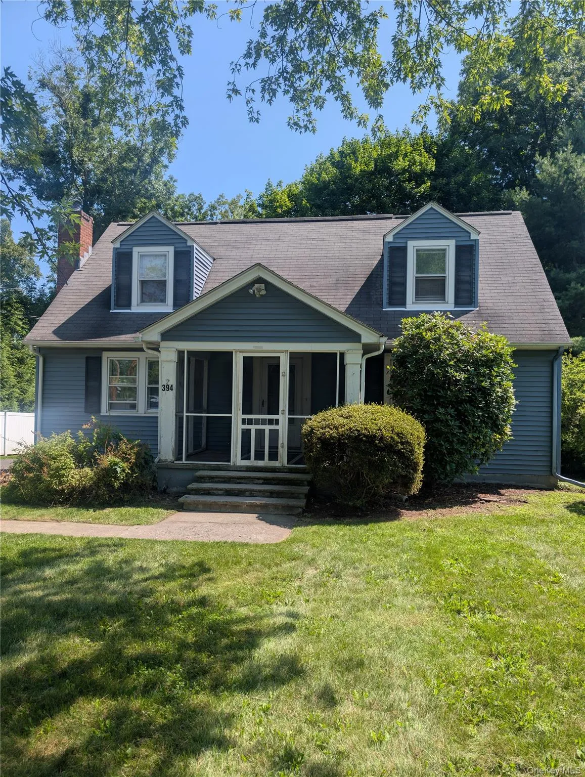 Screened front porch with paver walkway and front lawn. Screened front porch with paver walkway and front lawn.