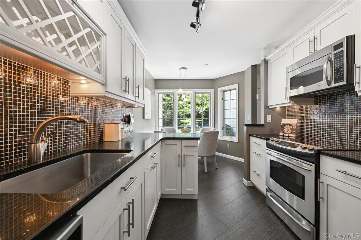 Kitchen has all Stainless Steel GE Profile appliances, & granite counters Kitchen has all Stainless Steel GE Profile appliances, & granite counters