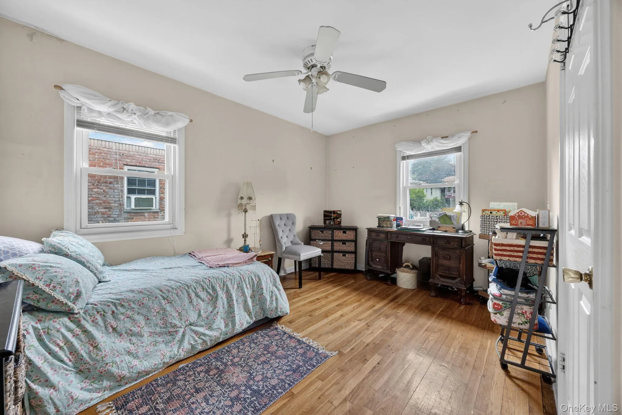 Hardwood flooring throughout, two windows for natural light, and a ceiling fan fixture Hardwood flooring throughout, two windows for natural light, and a ceiling fan fixture