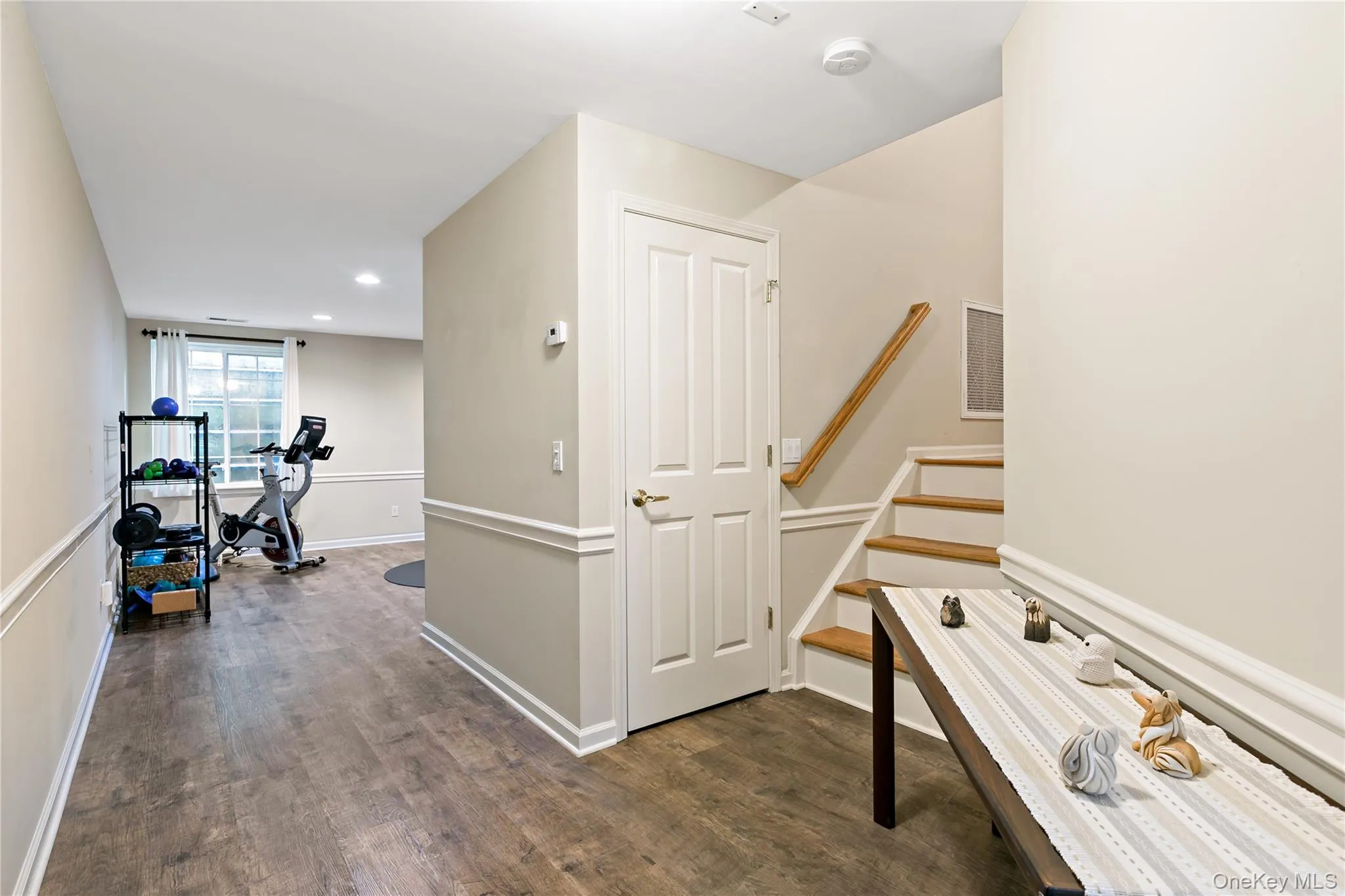 Spacious entry into the townhouse with coat closet and long hallway. Spacious entry into the townhouse with coat closet and long hallway.