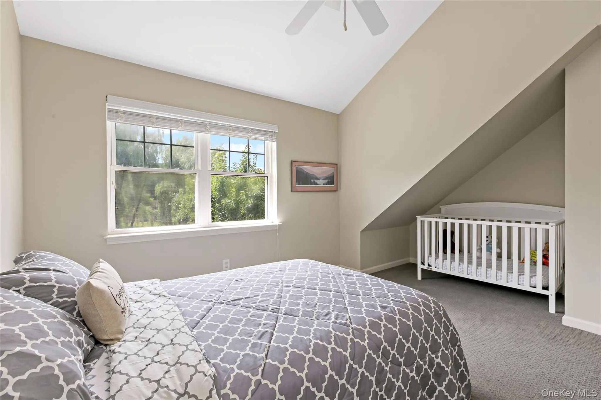 Second bedroom with Vaulted ceiling, double windows, ceiling fan and so much floor space. Second bedroom with Vaulted ceiling, double windows, ceiling fan and so much floor space.