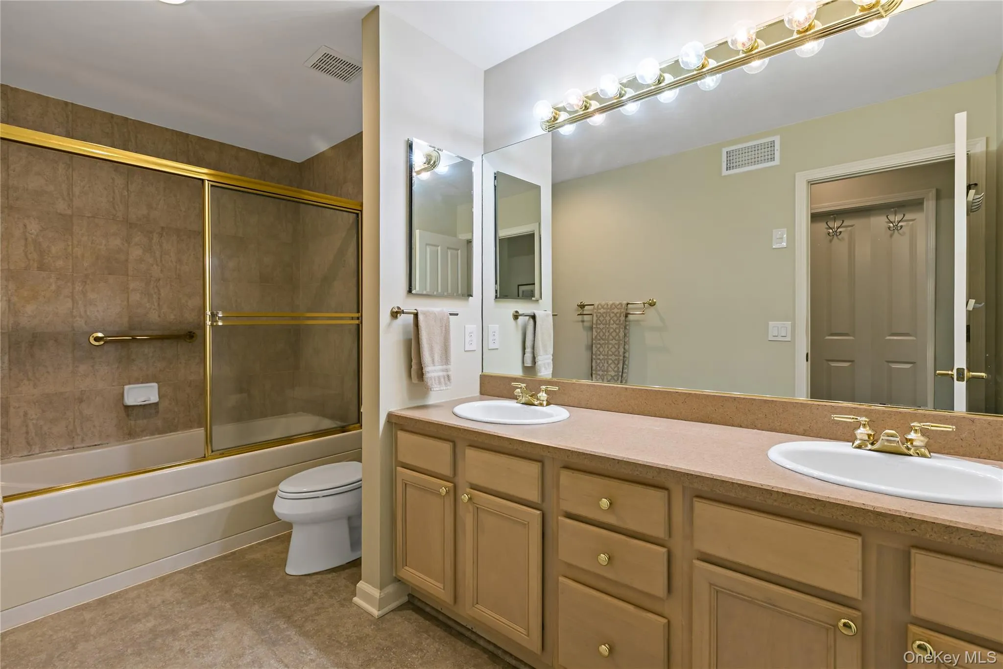 This spacious full bathroom complete with double sinks and tub/shower combo, all in neutral designer colors. This spacious full bathroom complete with double sinks and tub/shower combo, all in neutral designer colors.