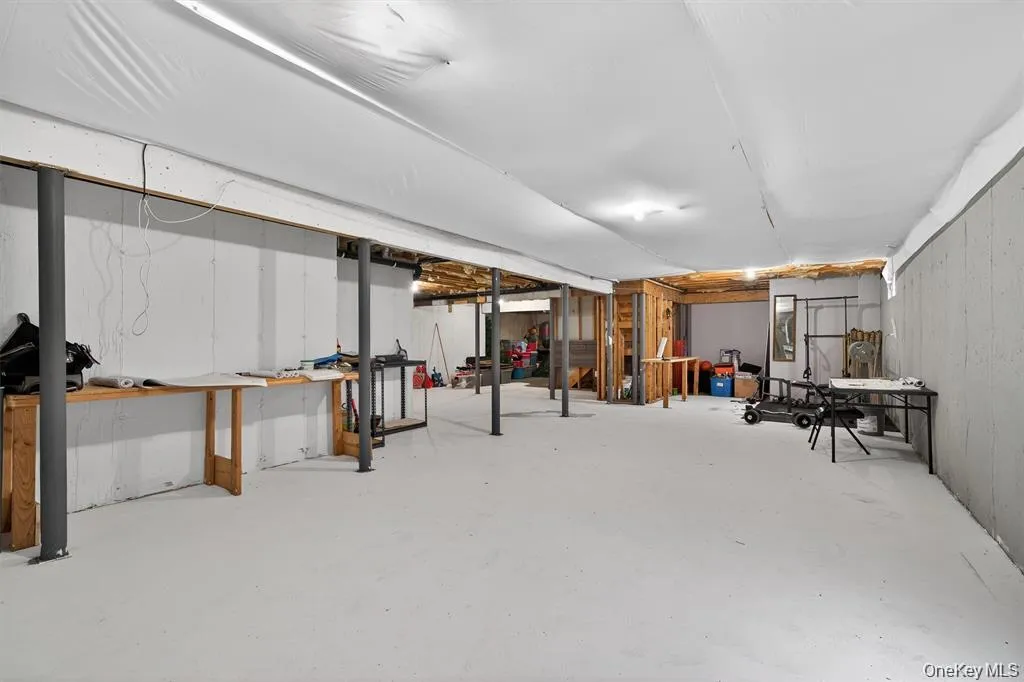 Spacious unfinished basement offering significant expansion potential with walkout Spacious unfinished basement offering significant expansion potential with walkout