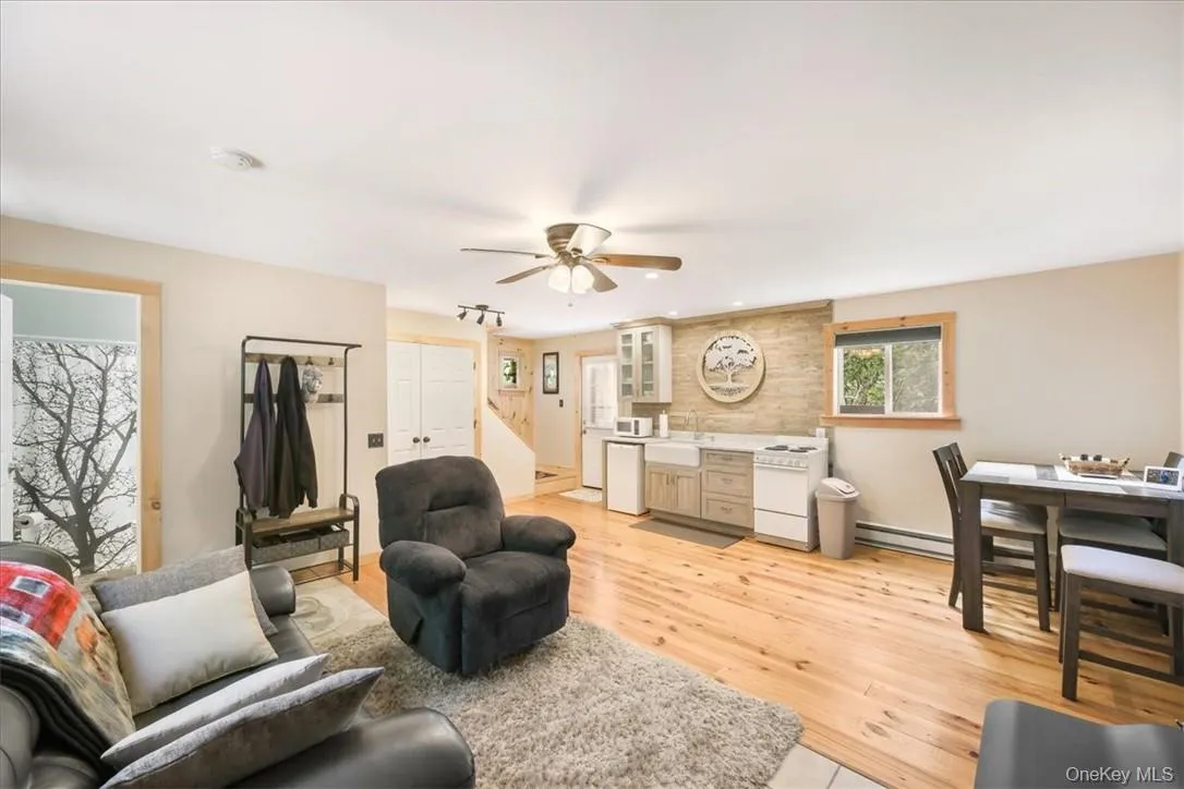 OPEN LIVING. Door to the left is open to see the Bathroom. OPEN LIVING. Door to the left is open to see the Bathroom.