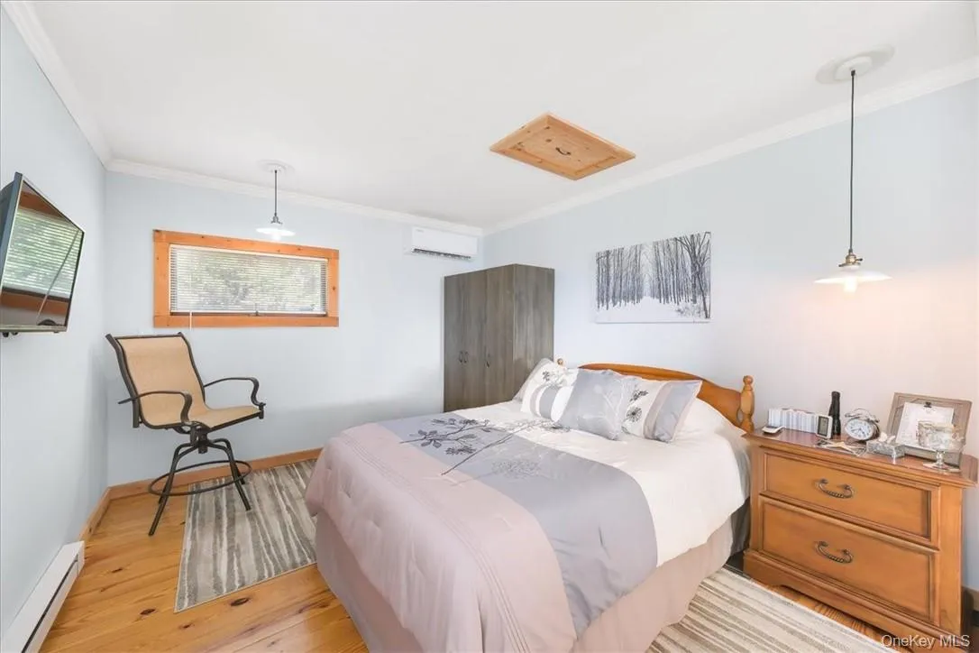 Master Bedroom Pine wood floors. Lighting stays. Baseboard heat also, but owner seldom uses them. Master Bedroom Pine wood floors. Lighting stays. Baseboard heat also, but owner seldom uses them.