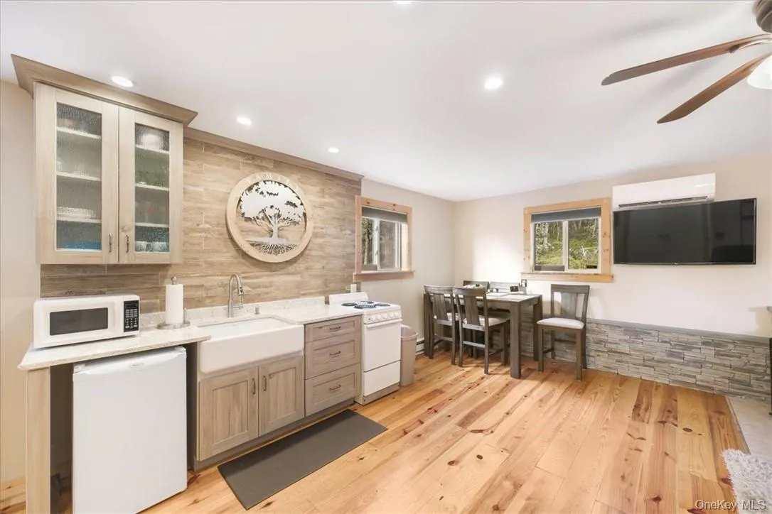 Close up of Kitchen & Dining. Double windows offer Great breezes and Light. Note the Mini Split, above the TV Close up of Kitchen & Dining. Double windows offer Great breezes and Light. Note the Mini Split, above the TV