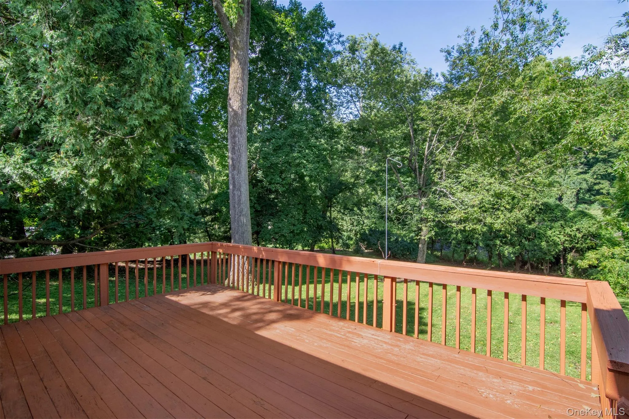 Expansive wood deck overlooking the large backyard. Expansive wood deck overlooking the large backyard.