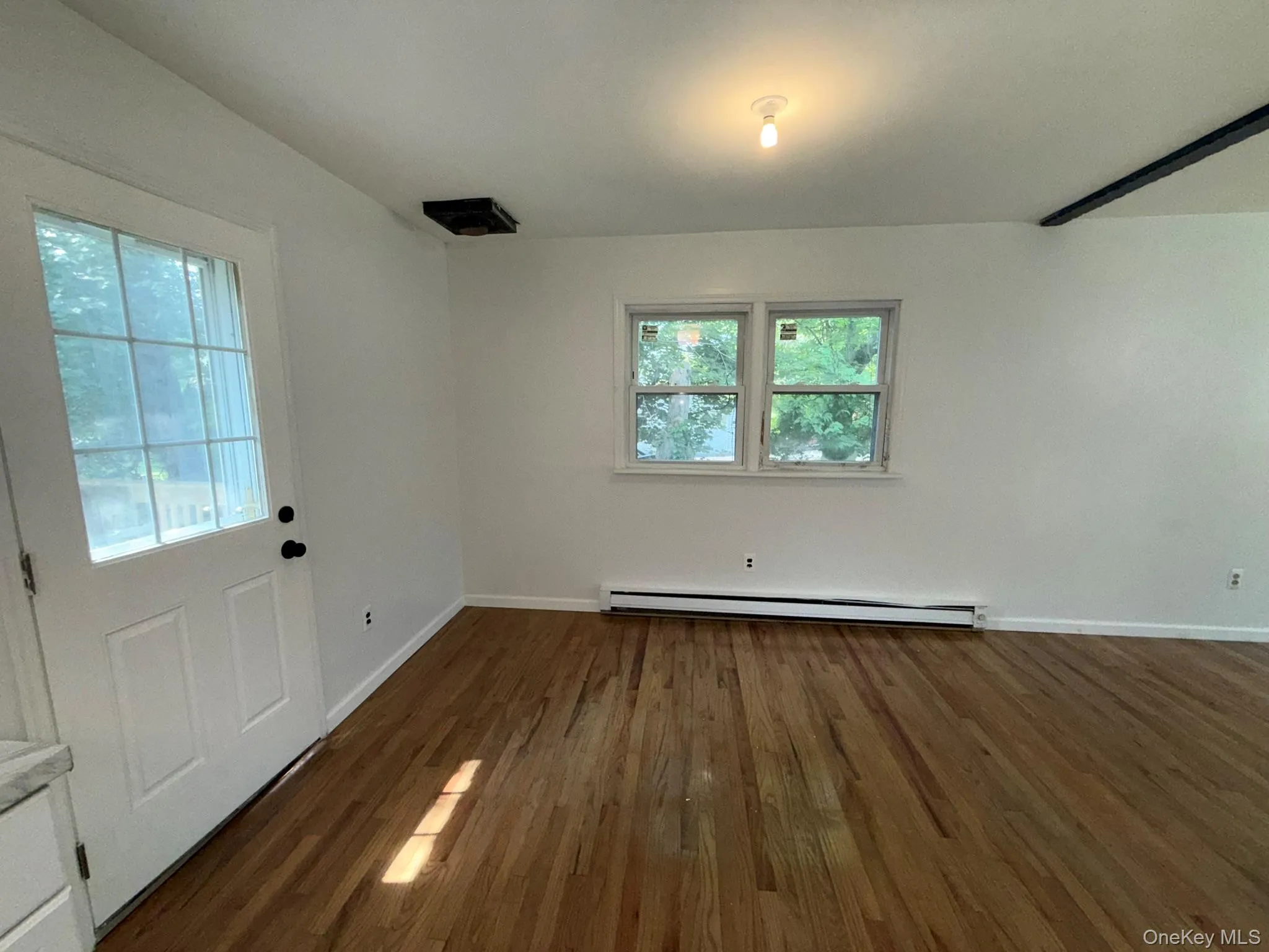 Door on the left leads to an outside deck Door on the left leads to an outside deck