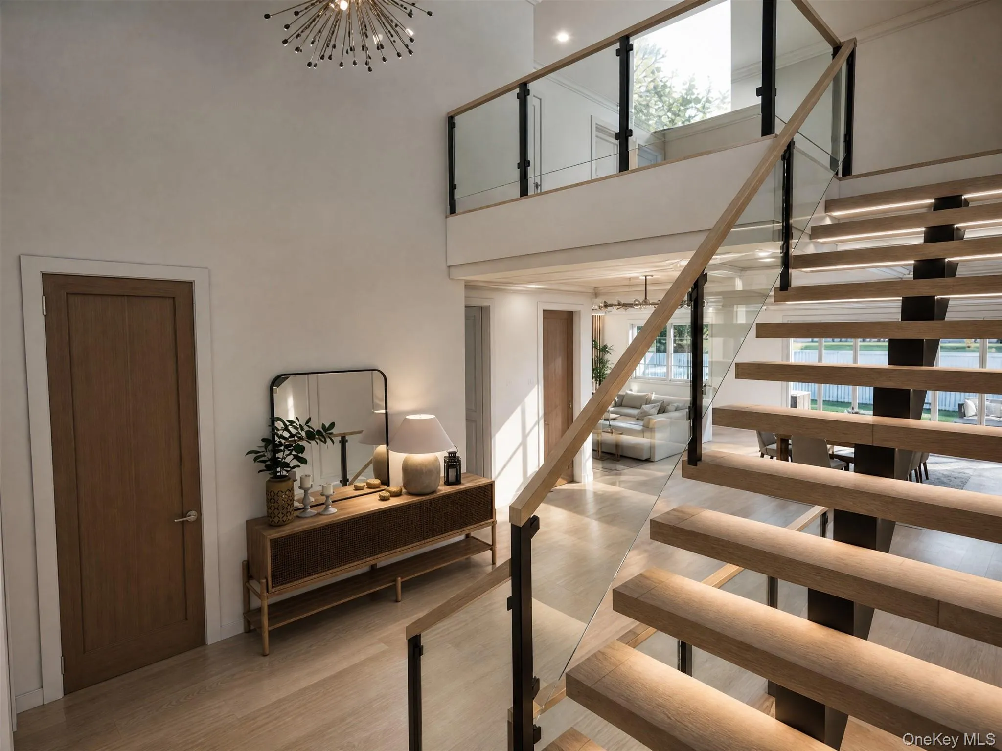 Floating wood-finish staircase featuring glass railings and a modern chandelier Floating wood-finish staircase featuring glass railings and a modern chandelier