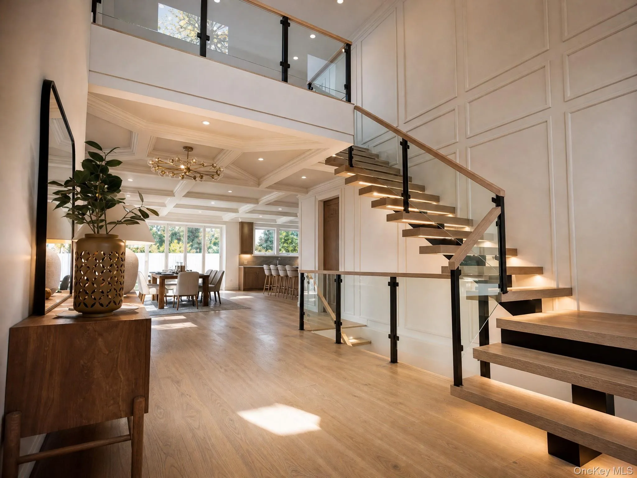 Floating wood-finish staircase with integrated lighting and glass railing Floating wood-finish staircase with integrated lighting and glass railing