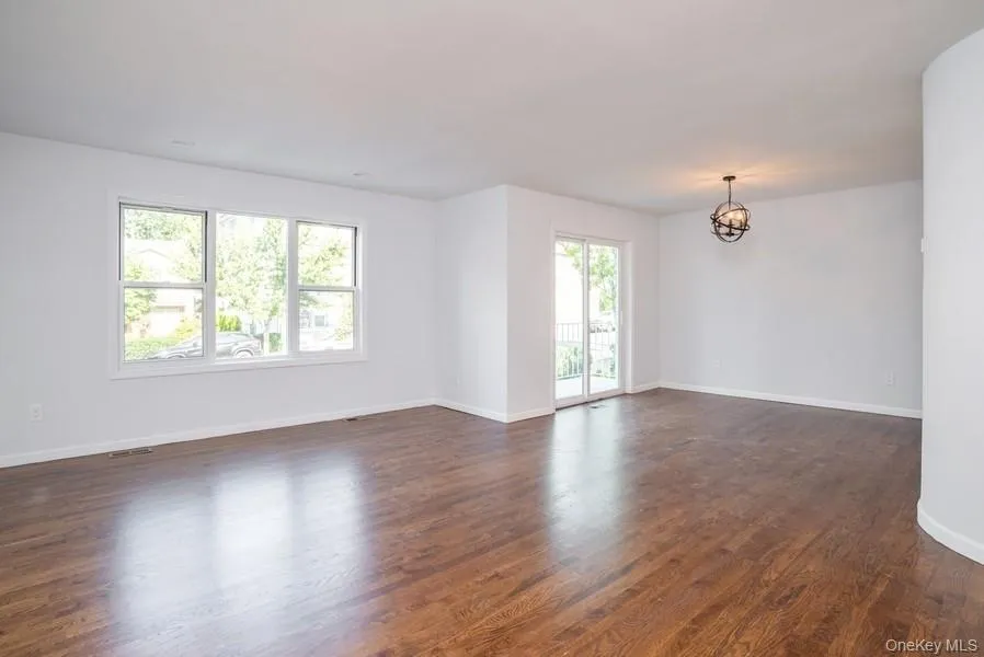 Light Filled Living Room/Dining Room with access to outdoor deck Light Filled Living Room/Dining Room with access to outdoor deck