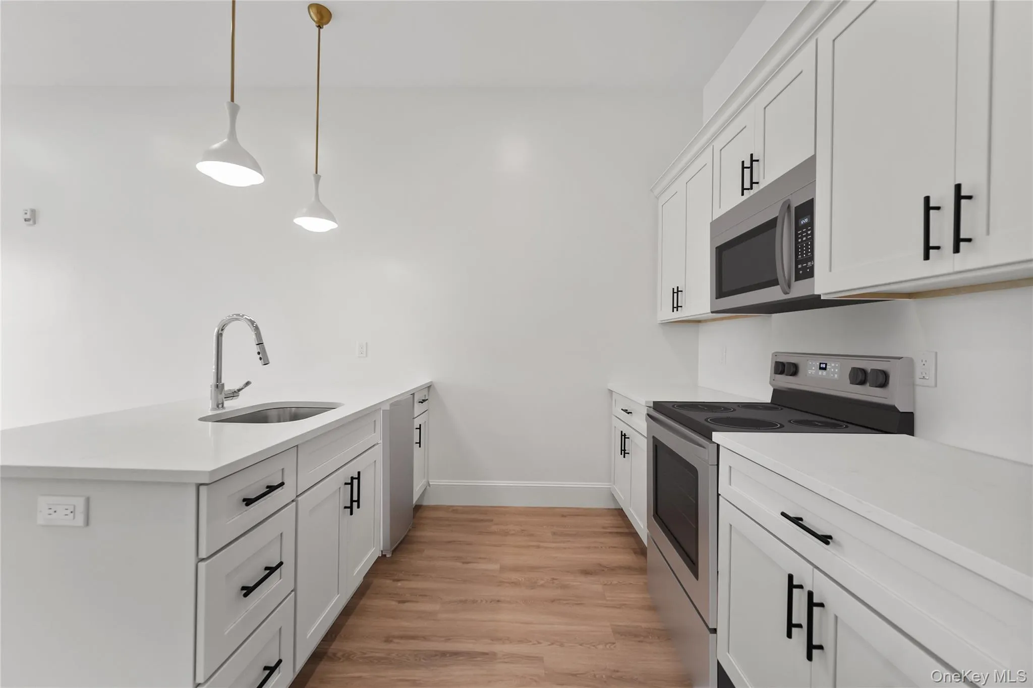 Kitchen with a large Island and stainless steel appliances Kitchen with a large Island and stainless steel appliances