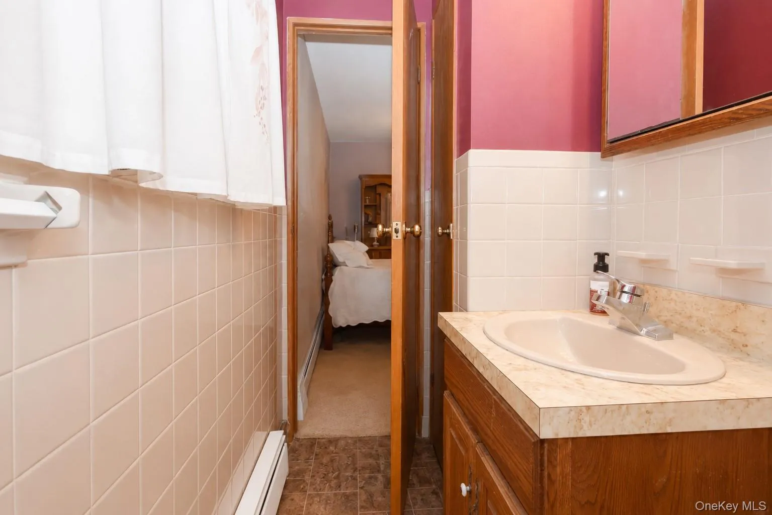 Bathroom vanity featuring a built-in sink and chrome faucet Bathroom vanity featuring a built-in sink and chrome faucet