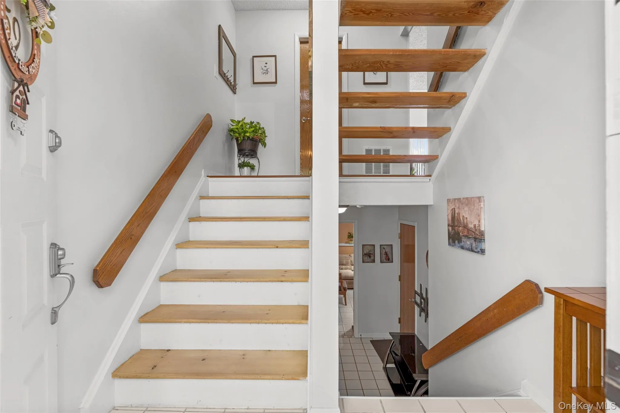 Up the stairs from foyer to main living level with Powder room conveniently located at top of stairs. Again, not all 1Br units offer a Powder Rm. Up the stairs from foyer to main living level with Powder room conveniently located at top of stairs. Again, not all 1Br units offer a Powder Rm.