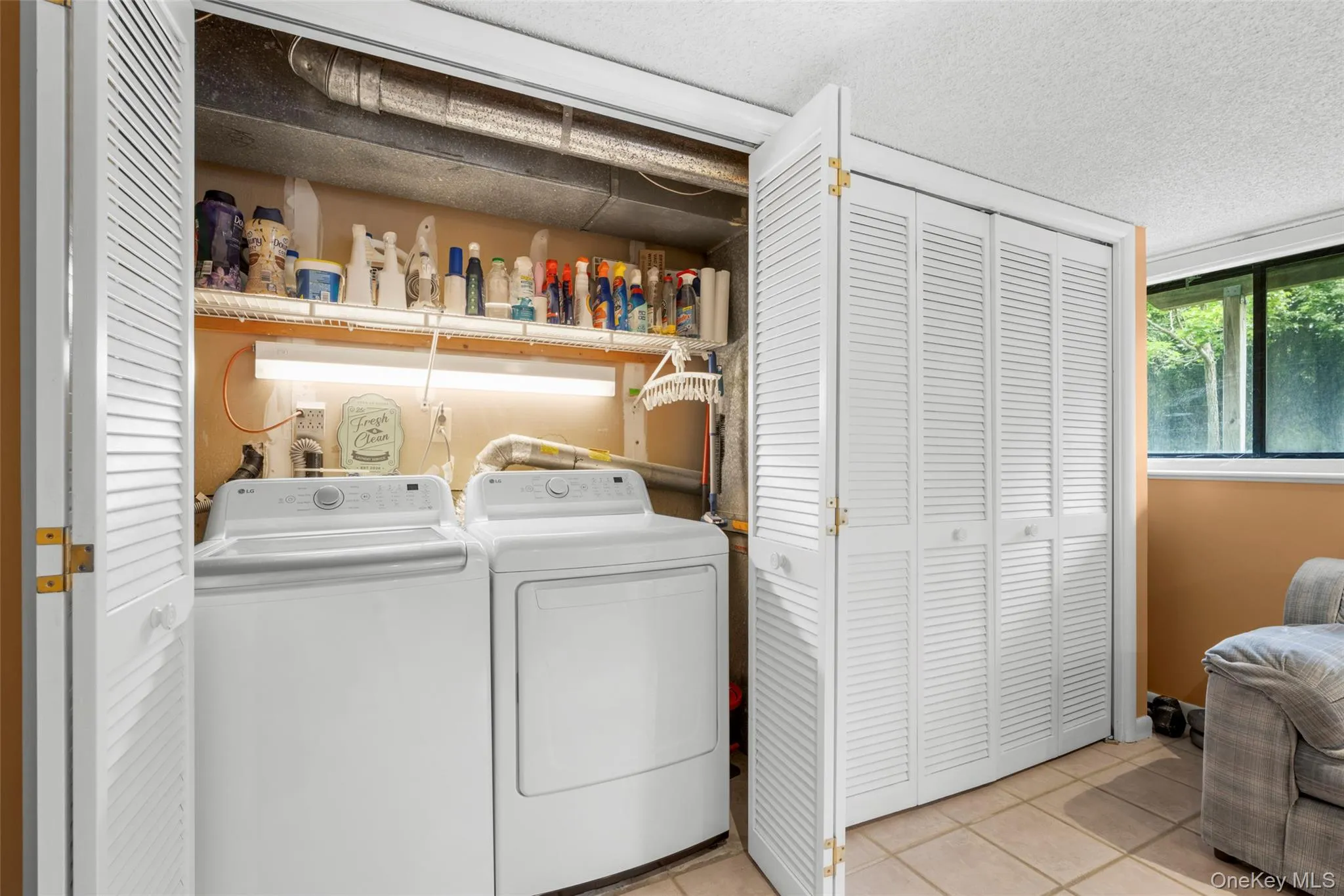 Immediately stepping into Family Rm you will find laundry on your left behind closet doors. New LG Washer & Dryer (2026.) Mechanicals behind adjacent closet doors. Immediately stepping into Family Rm you will find laundry on your left behind closet doors. New LG Washer & Dryer (2026.) Mechanicals behind adjacent closet doors.
