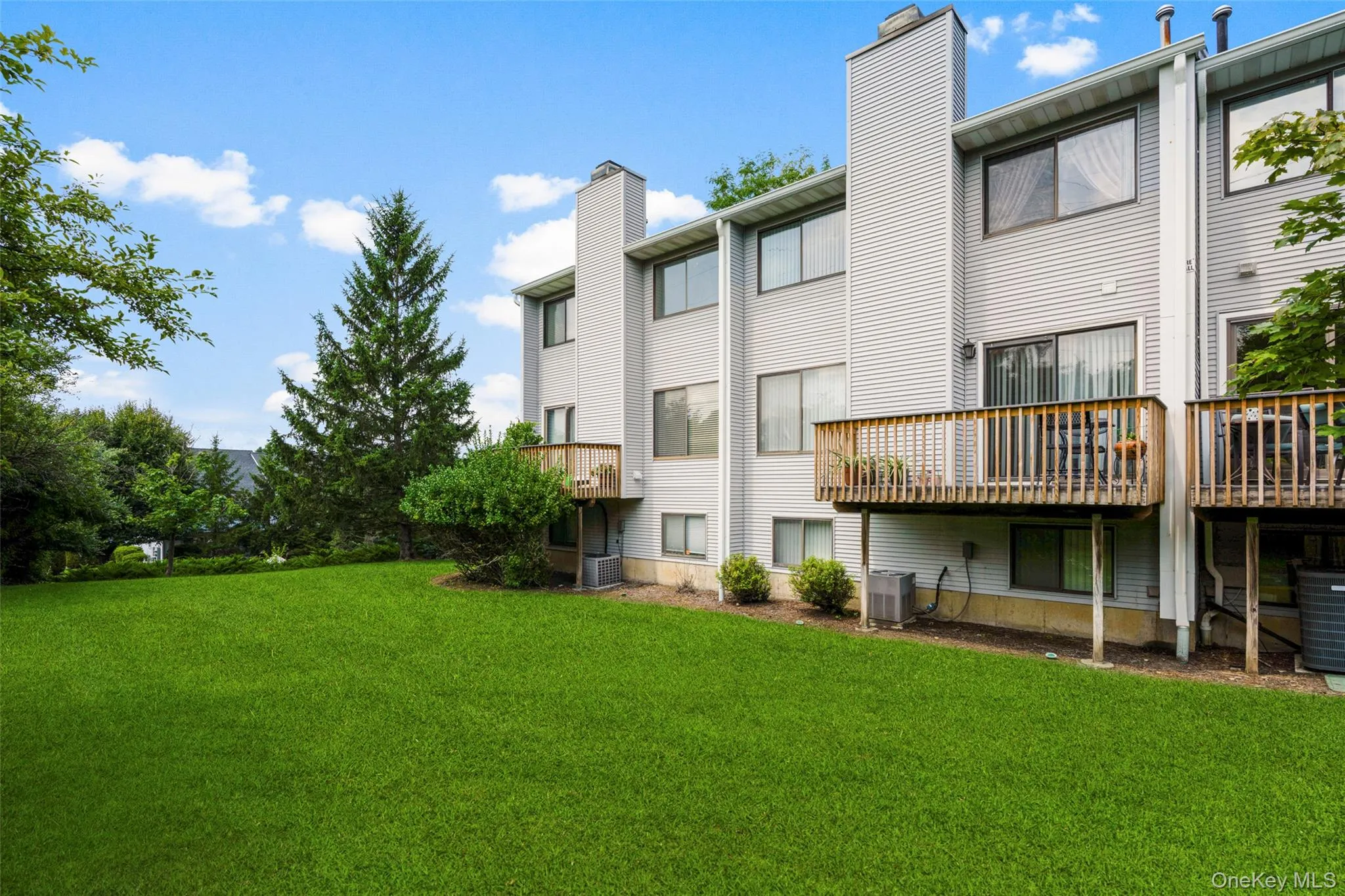 Rather than looking at the back of other townhouses this Deck provides a more private view of gorgeous Trees & Grassy Level Backyard. Rather than looking at the back of other townhouses this Deck provides a more private view of gorgeous Trees & Grassy Level Backyard.