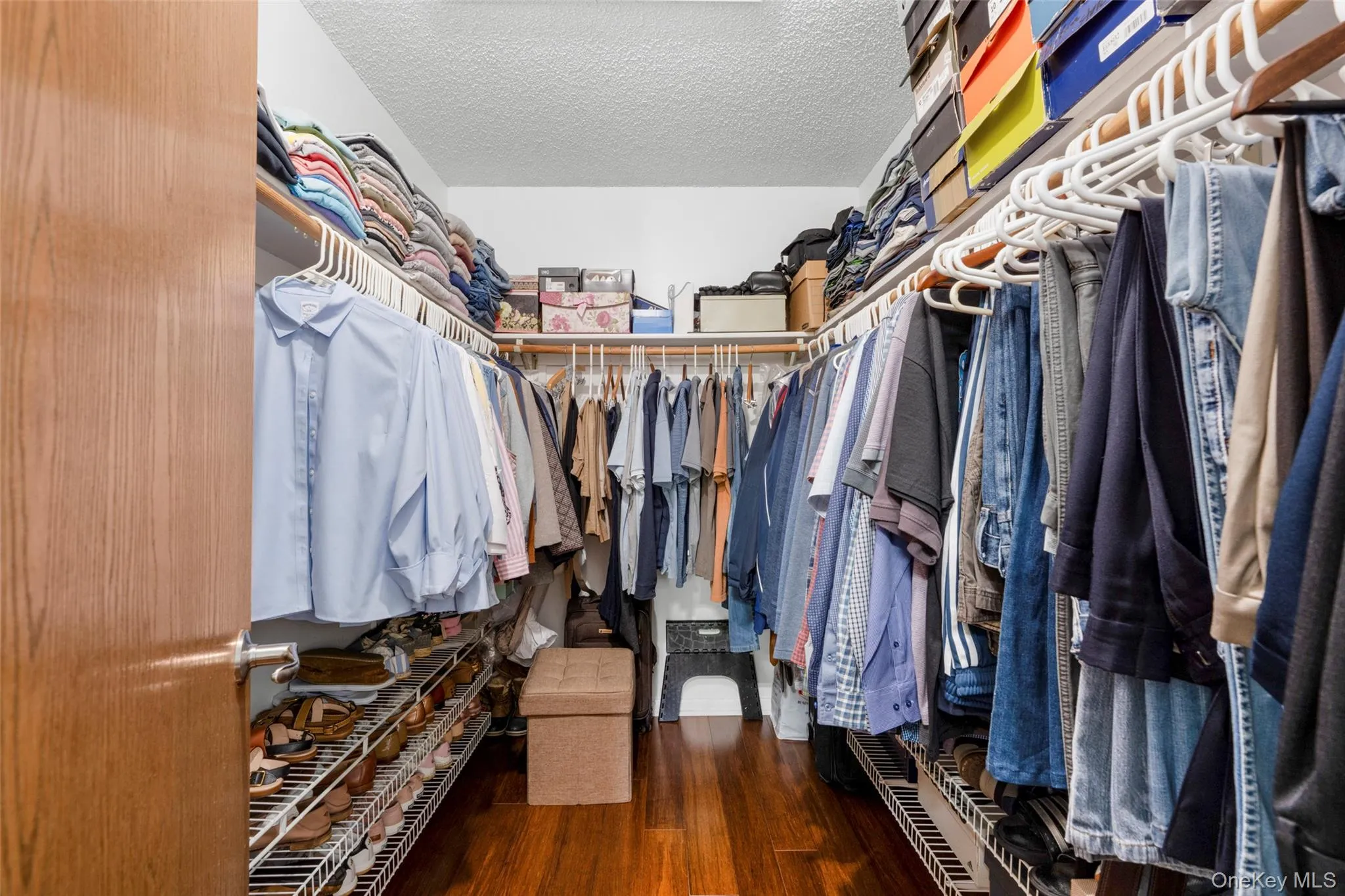 Bamboo floors continue into this Big Dreamy Primary Walk-in Closet adding to its sense of luxury. Bamboo floors continue into this Big Dreamy Primary Walk-in Closet adding to its sense of luxury.