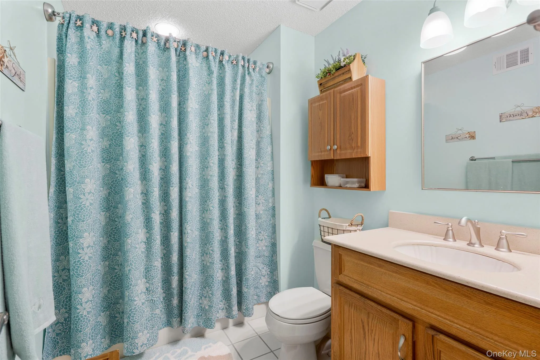 Sizable Bathroom provides good storage with vanity & Wall Cabinet for those extra cosmetics or medicinals. Sizable Bathroom provides good storage with vanity & Wall Cabinet for those extra cosmetics or medicinals.