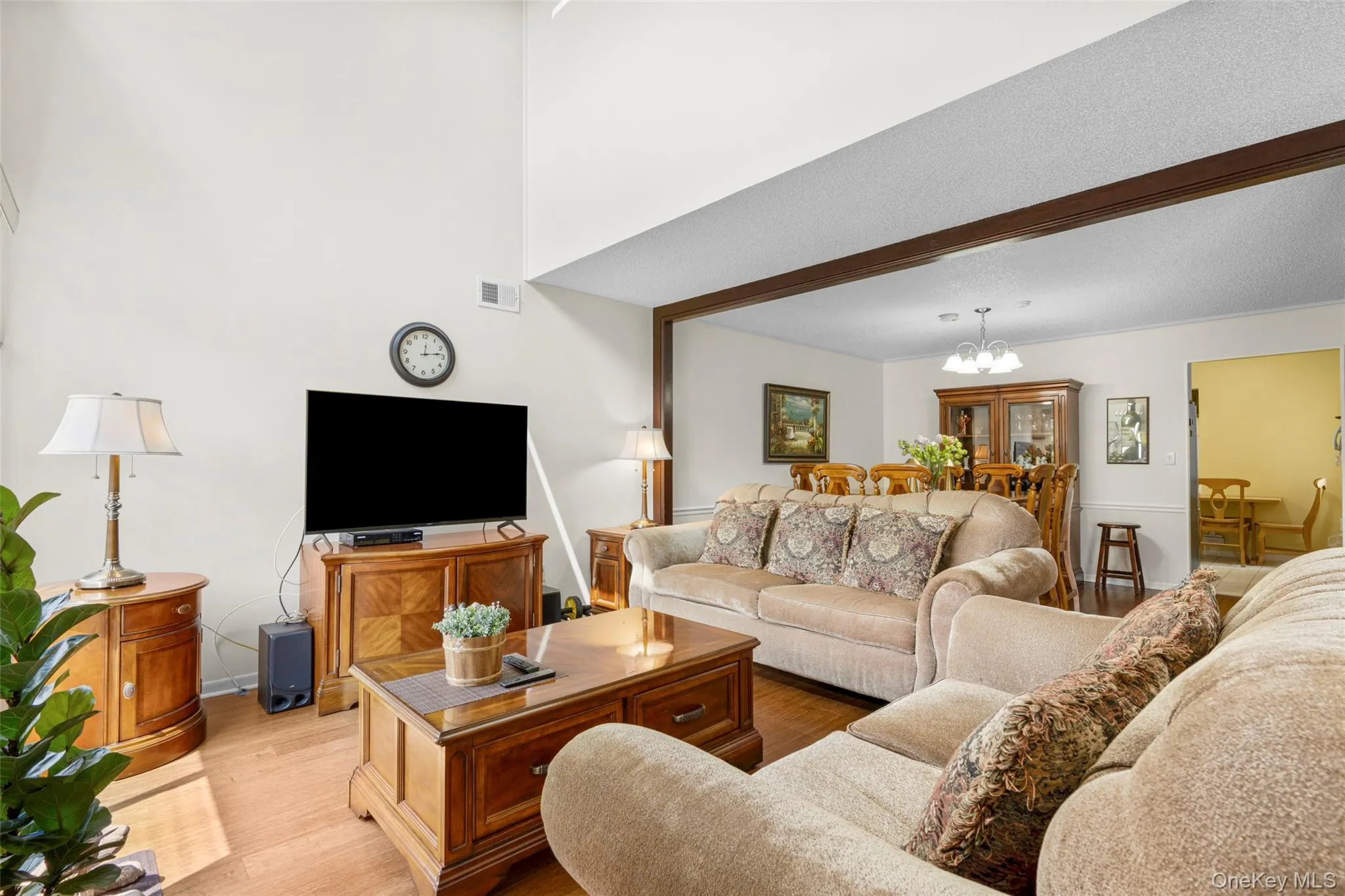 View of Living room towards Dining Room & Kitchen illustrates the thoughtfully designed layout for easy lifestyle flow being offered by this townhouse floorplan. View of Living room towards Dining Room & Kitchen illustrates the thoughtfully designed layout for easy lifestyle flow being offered by this townhouse floorplan.