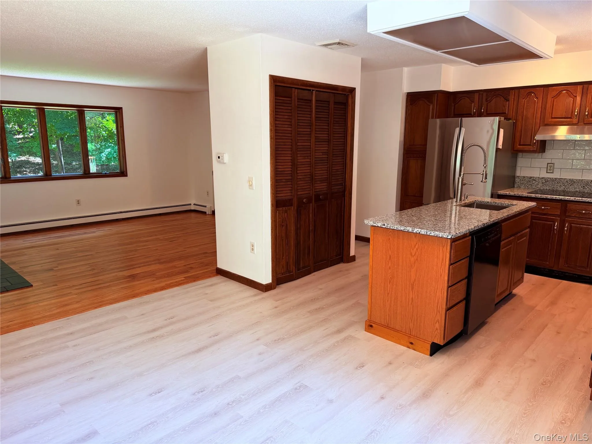 Kitchen with new granite counters, island, double oven and pantry. Kitchen with new granite counters, island, double oven and pantry.