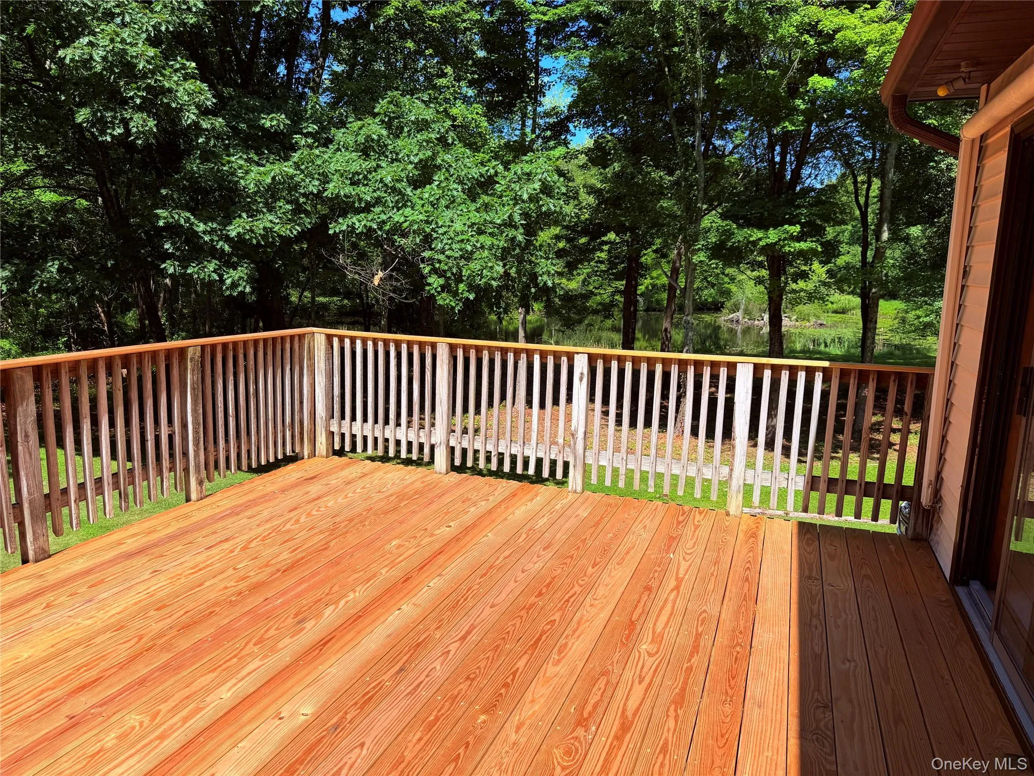 Deck overlooking the beautiful private backyard Deck overlooking the beautiful private backyard